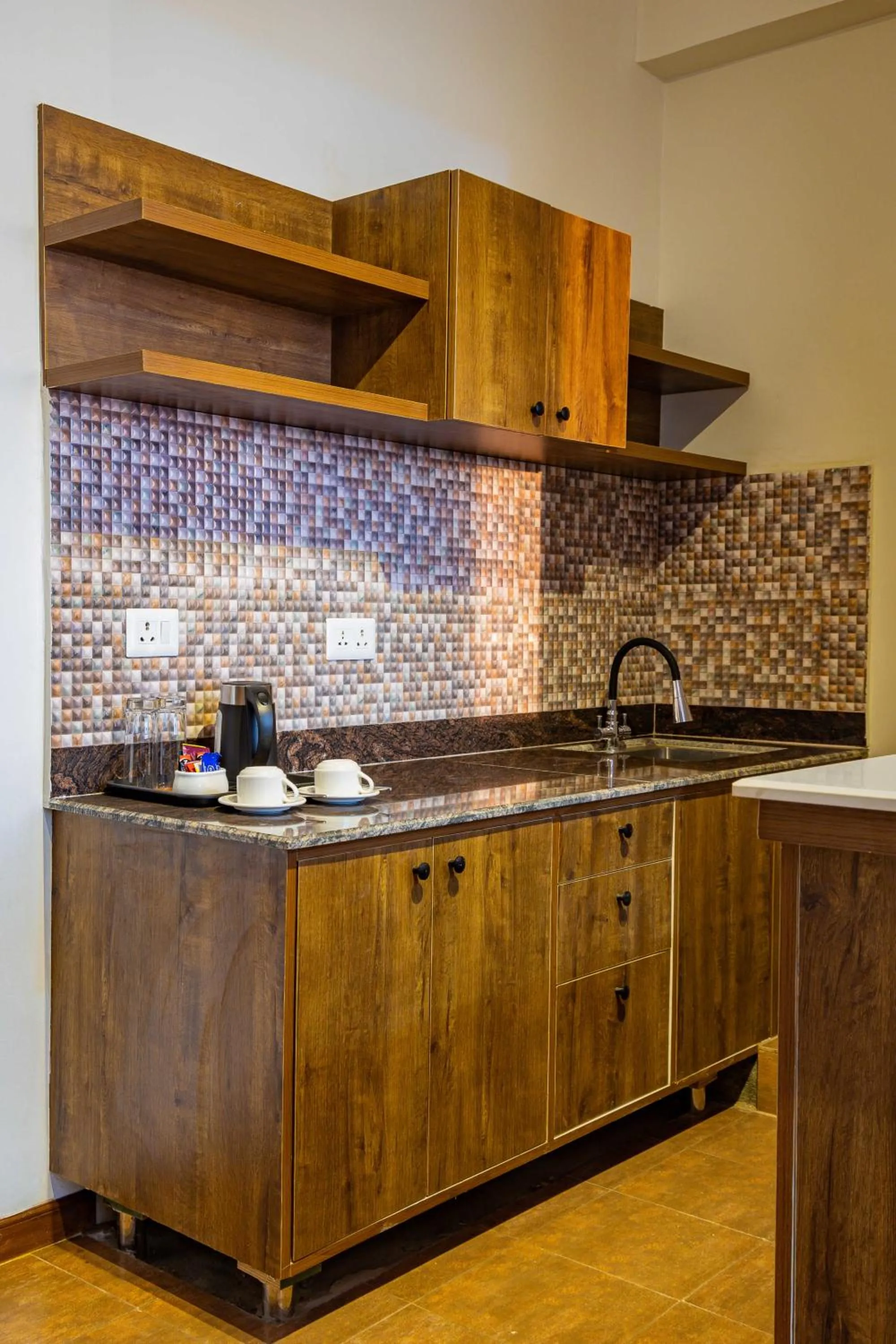 Kitchen or kitchenette in Mhendo Hotel & Studio Suites