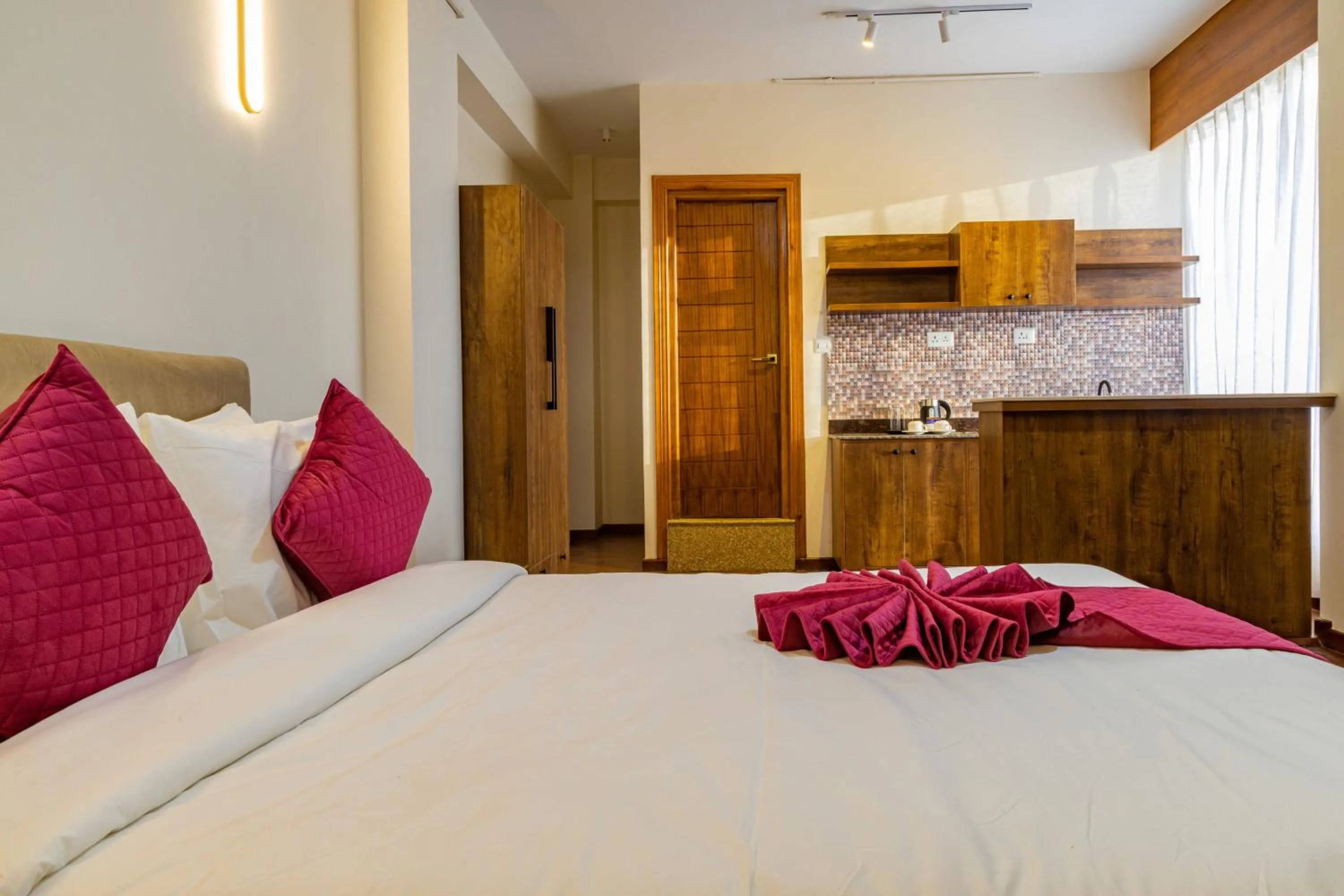 Bed in Mhendo Hotel & Studio Suites