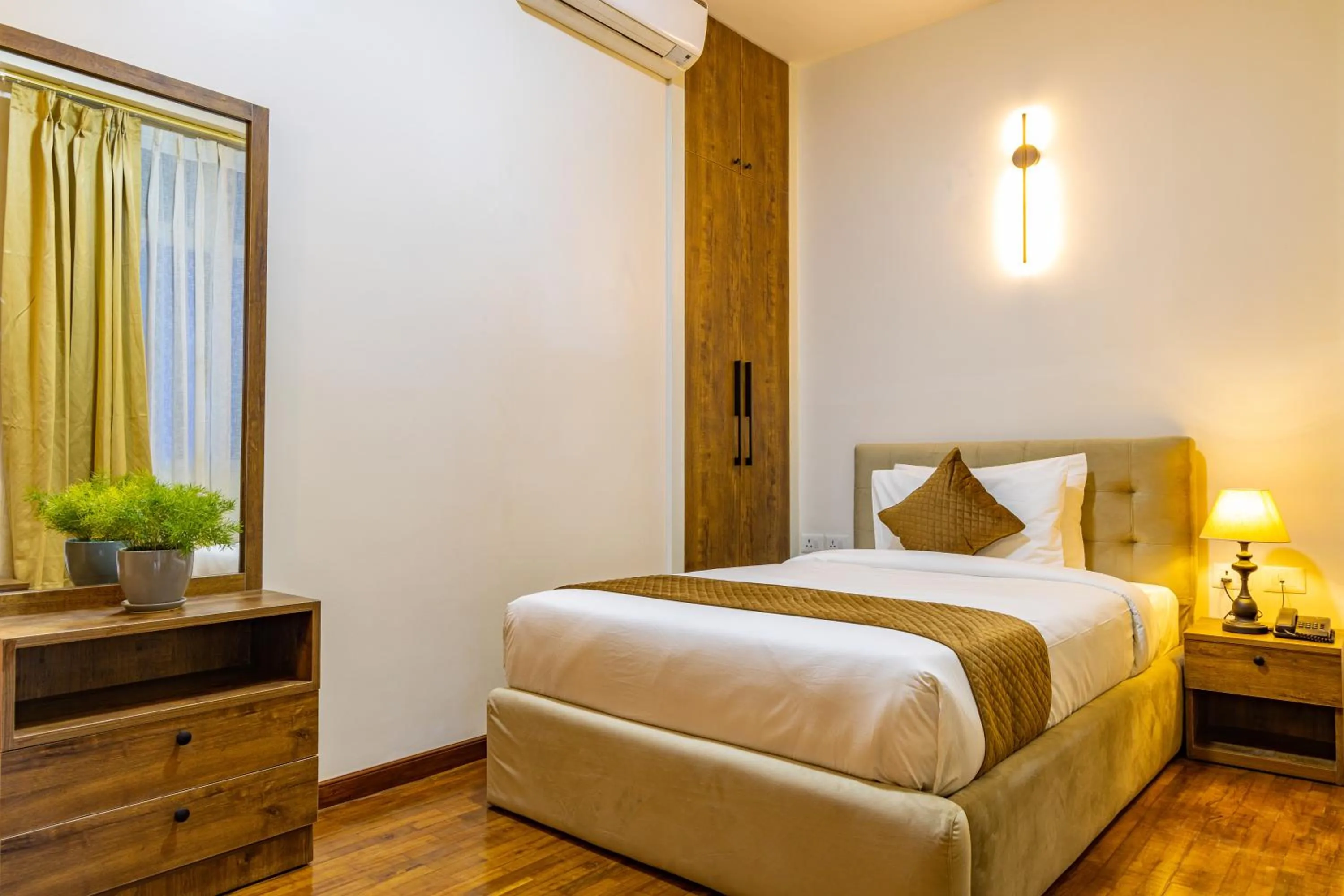 Bed in Mhendo Hotel & Studio Suites