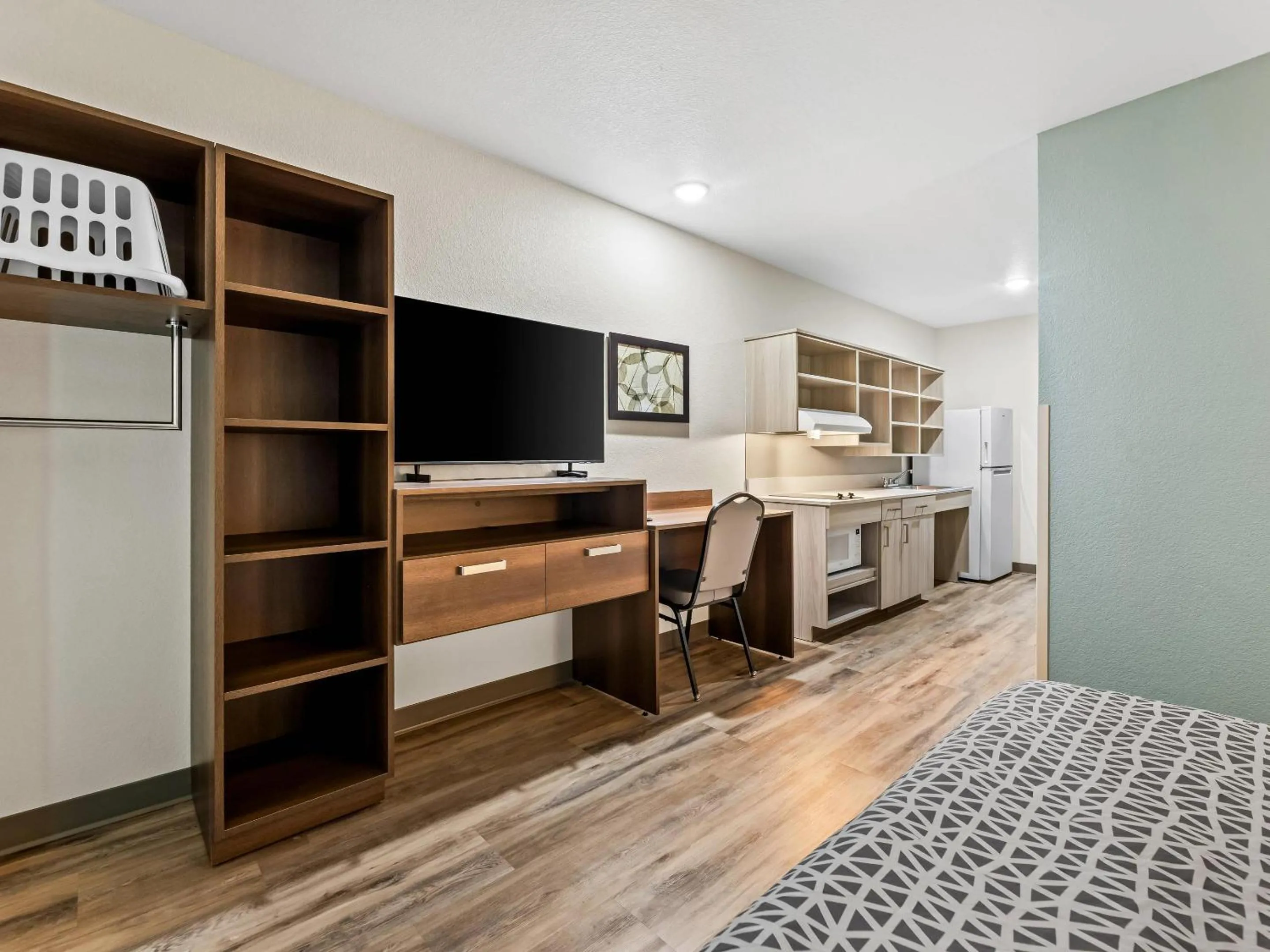 Bedroom in WoodSpring Suites Prattville - Montgomery North