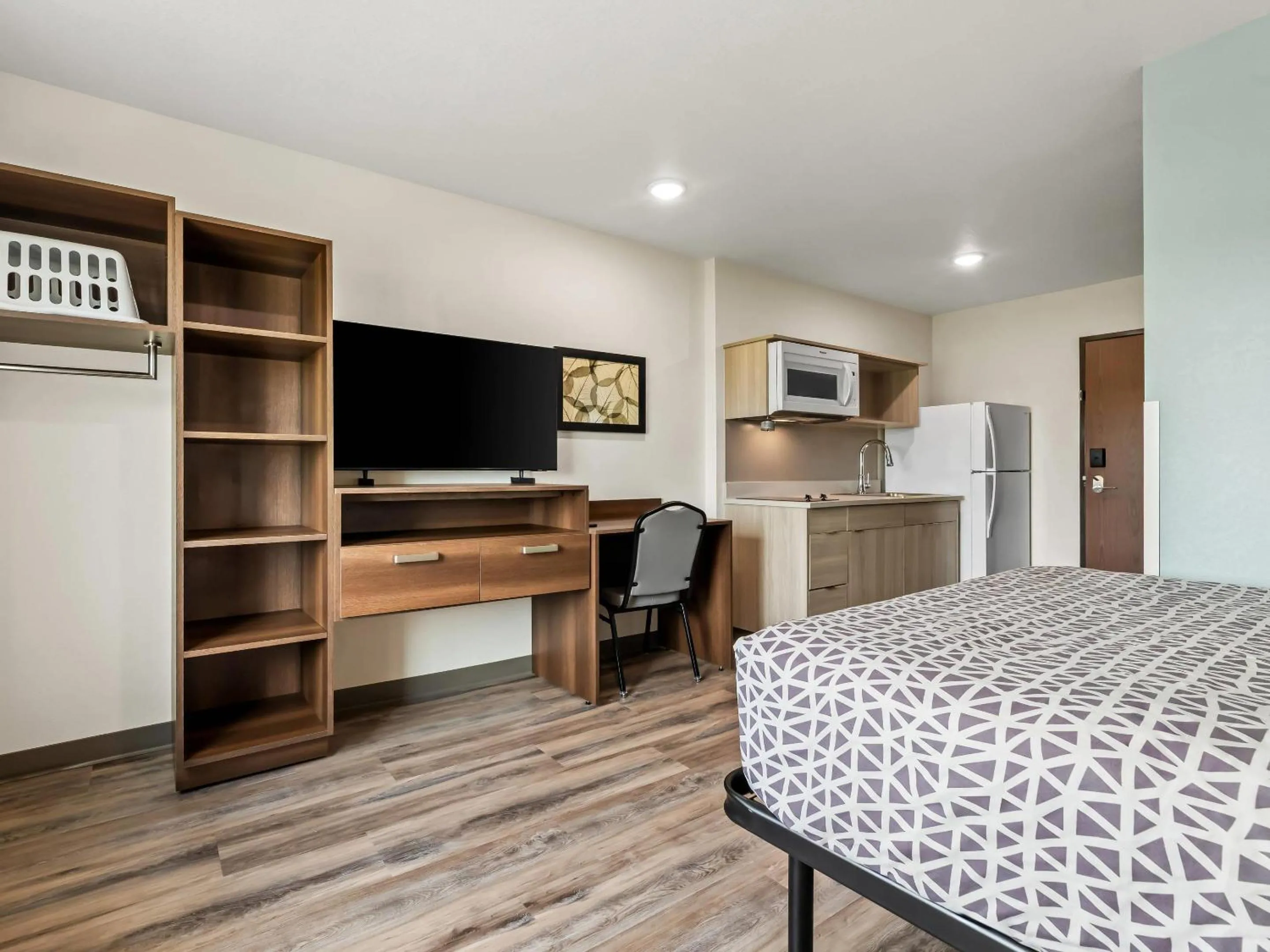 Bedroom in WoodSpring Suites Prattville - Montgomery North