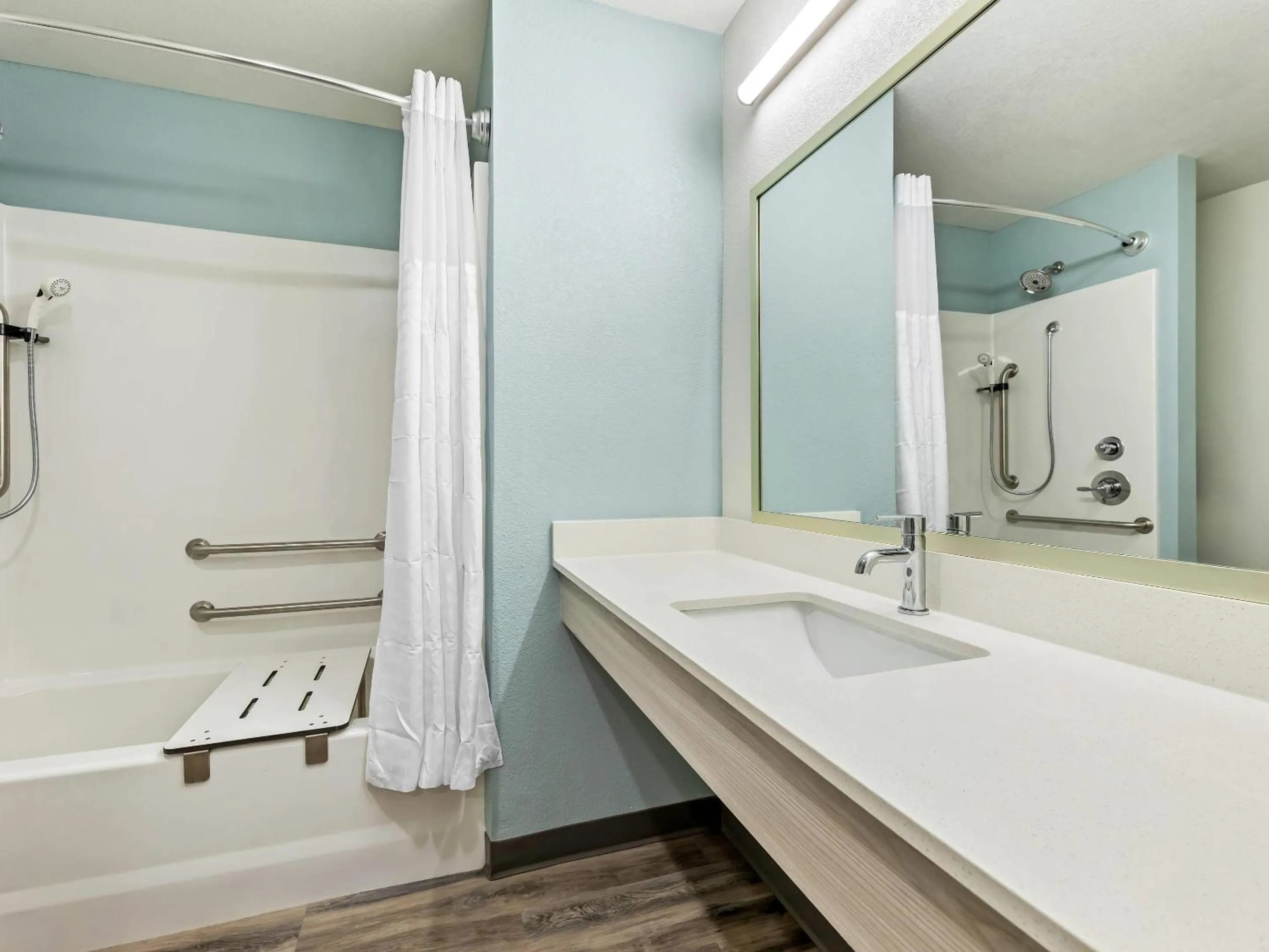 Bedroom in WoodSpring Suites Prattville - Montgomery North