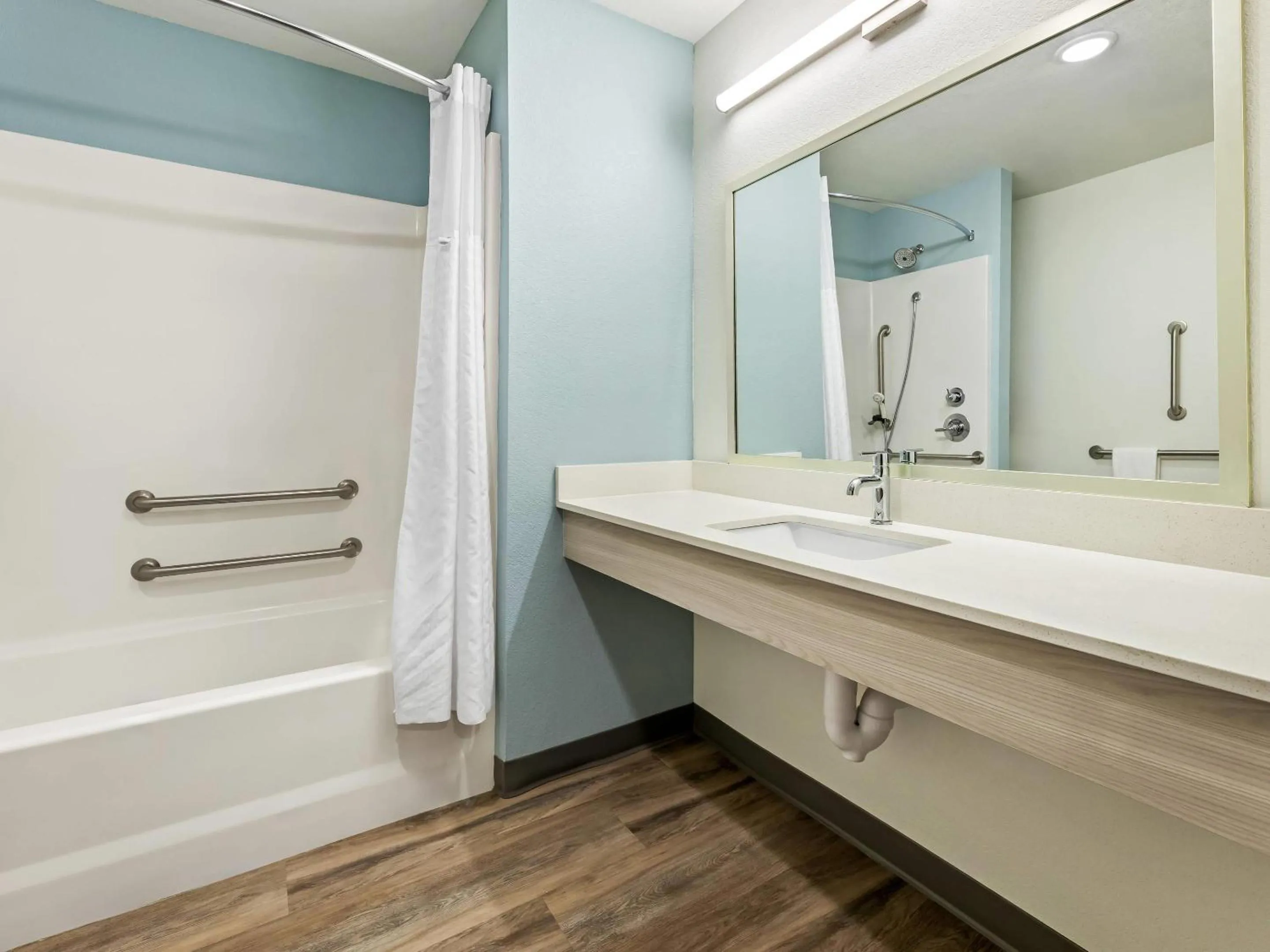 Bedroom in WoodSpring Suites Prattville - Montgomery North