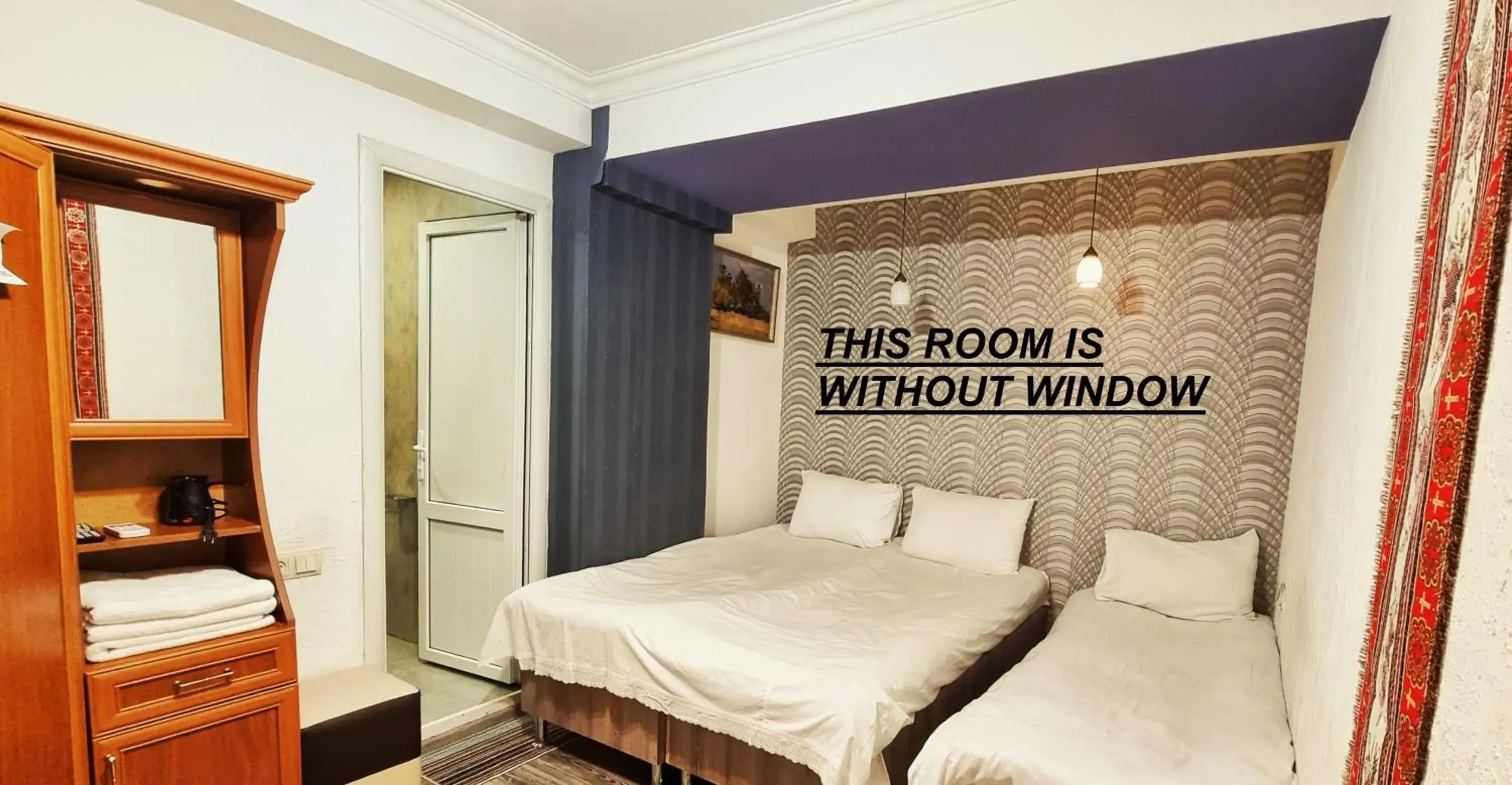 Economy Triple Room in Apple Hotel Economy Triple Room in Apple Hotel
