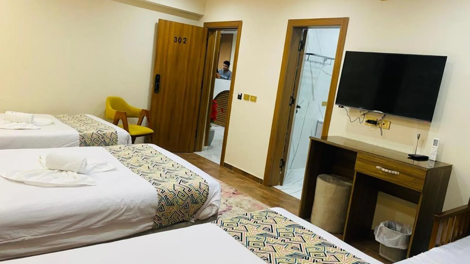 Communal lounge/ TV room, Bed in Golden Season Hotel