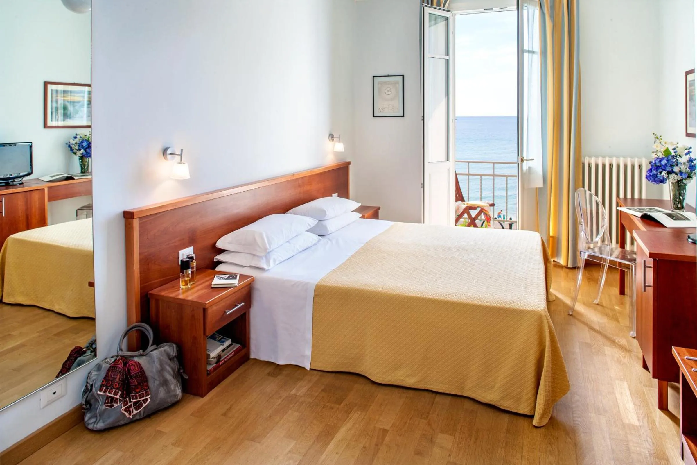 Bed in Hotel Beau Sejour