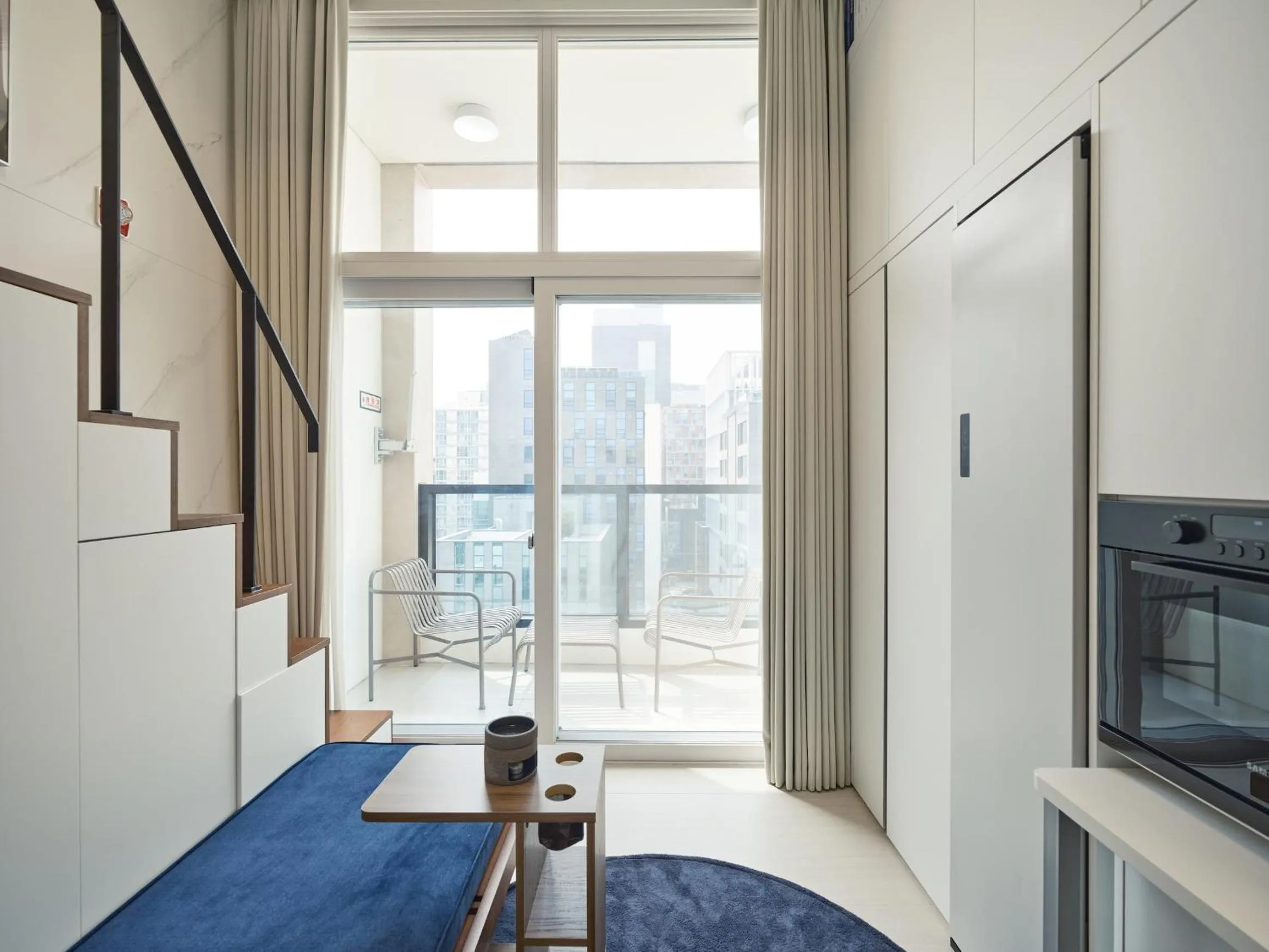 Living room, Bed in UH FLAT Signature GANGNAM