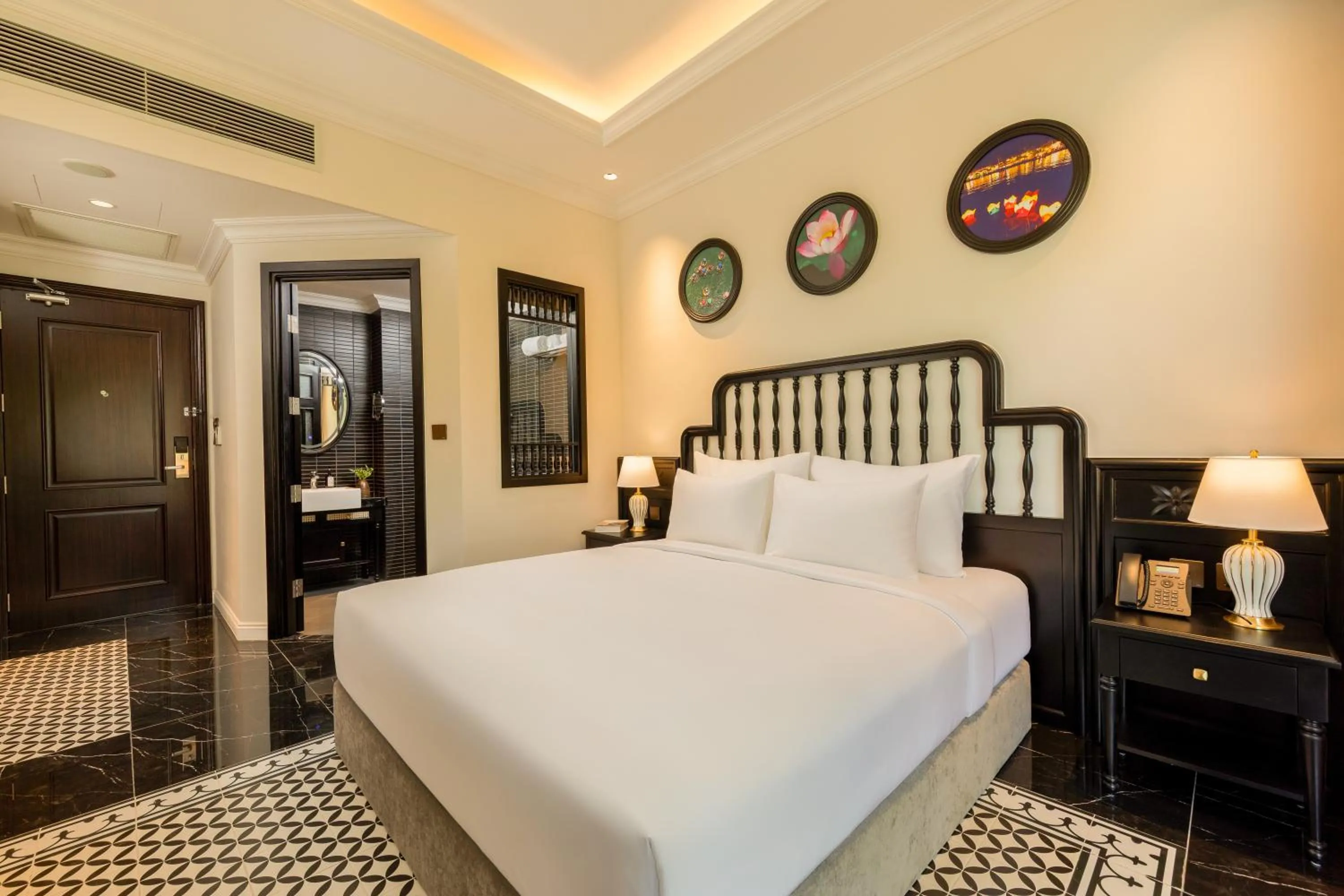 Bed in Nesta Hoian Resort & Spa