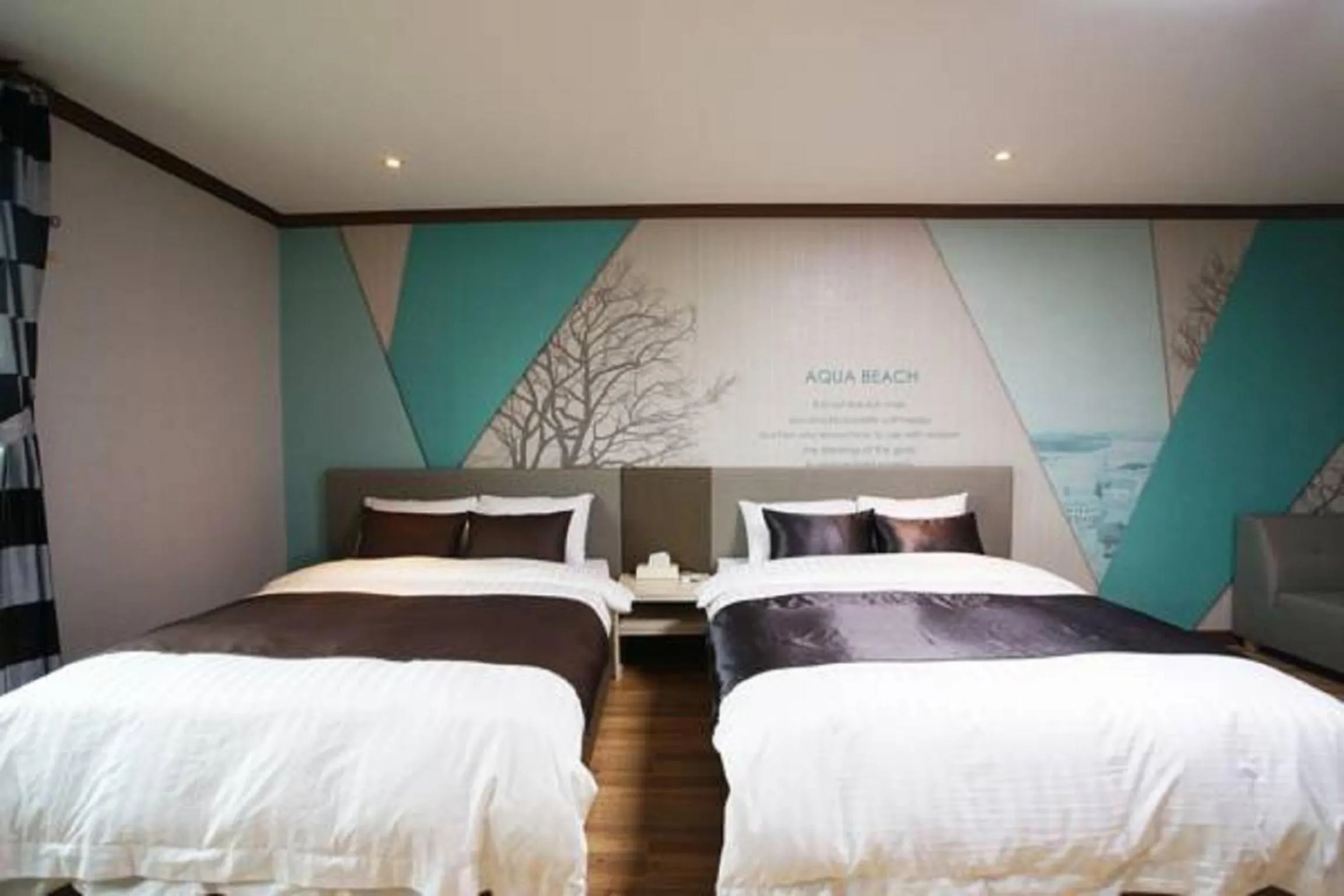 Bed in Seongsan Aqua Beach Hotel
