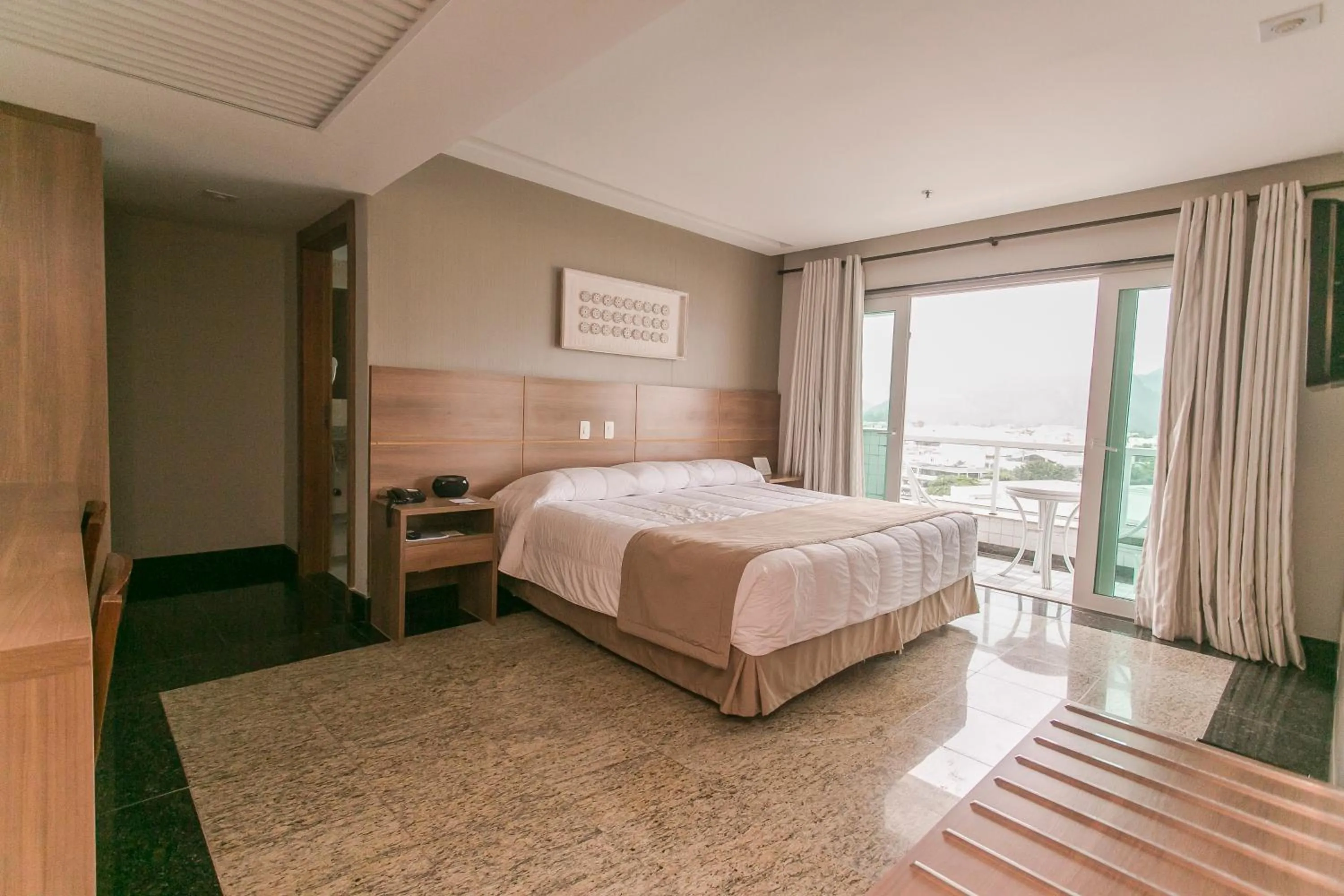 Bed in Royalty Barra Hotel