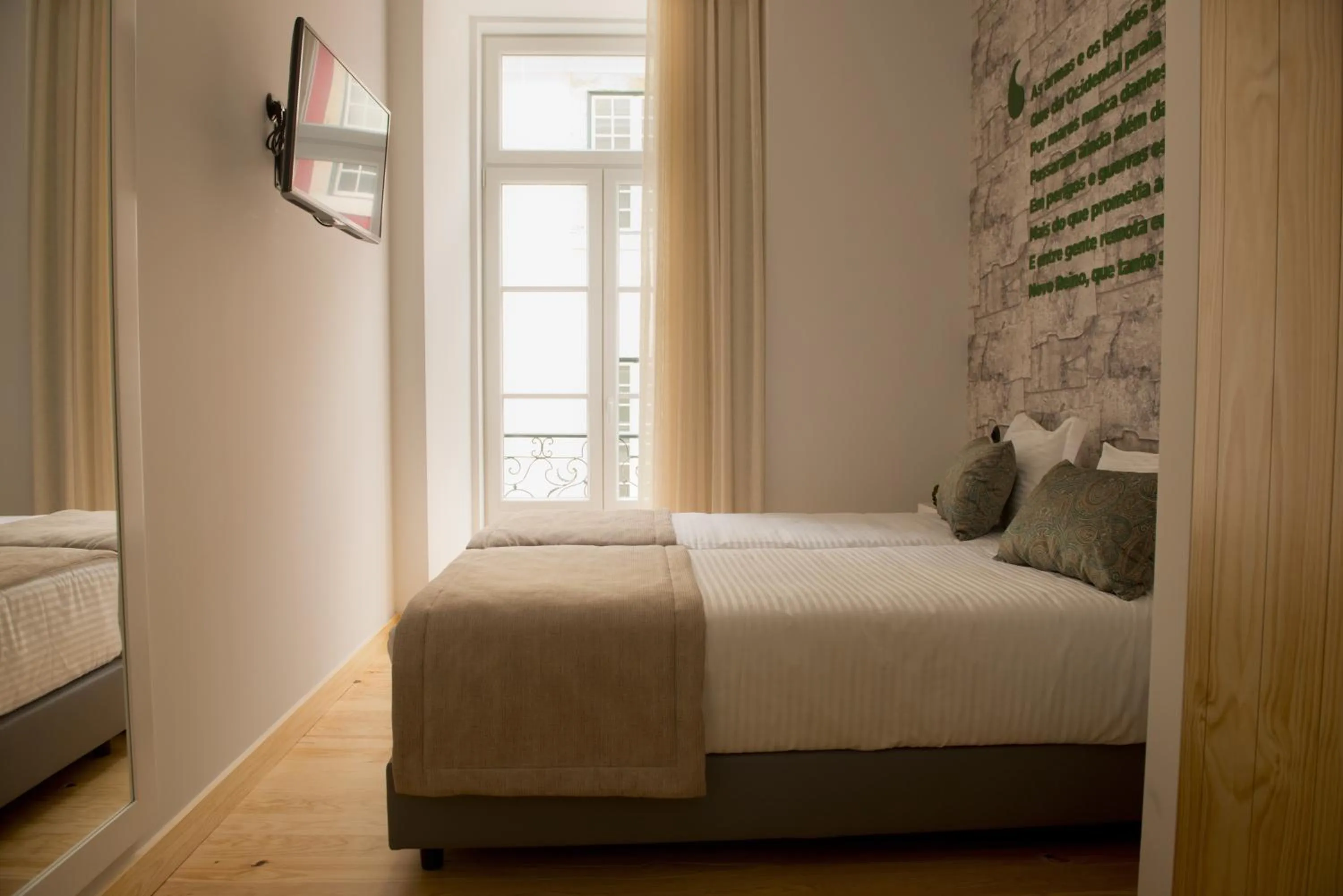 Bed in Páteo Saudade Lofts