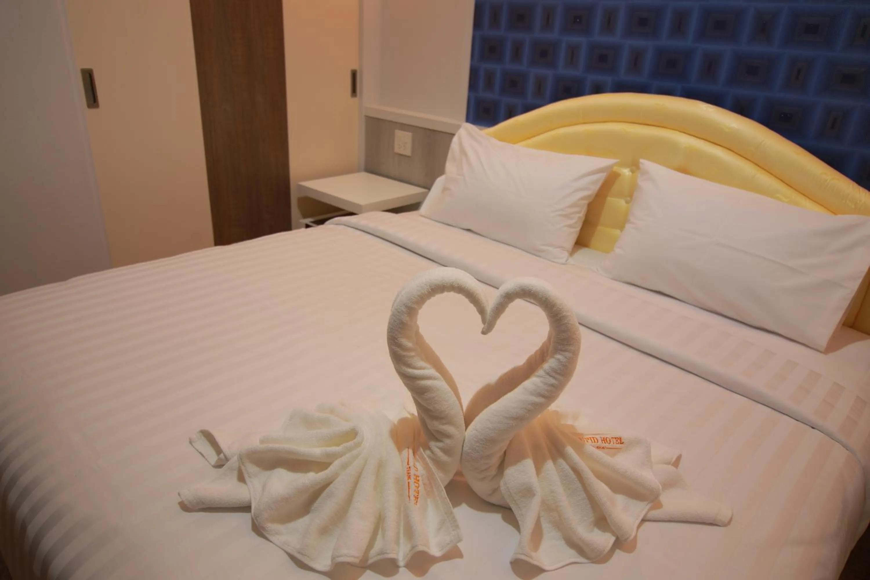 Bed in Cupid Hotel