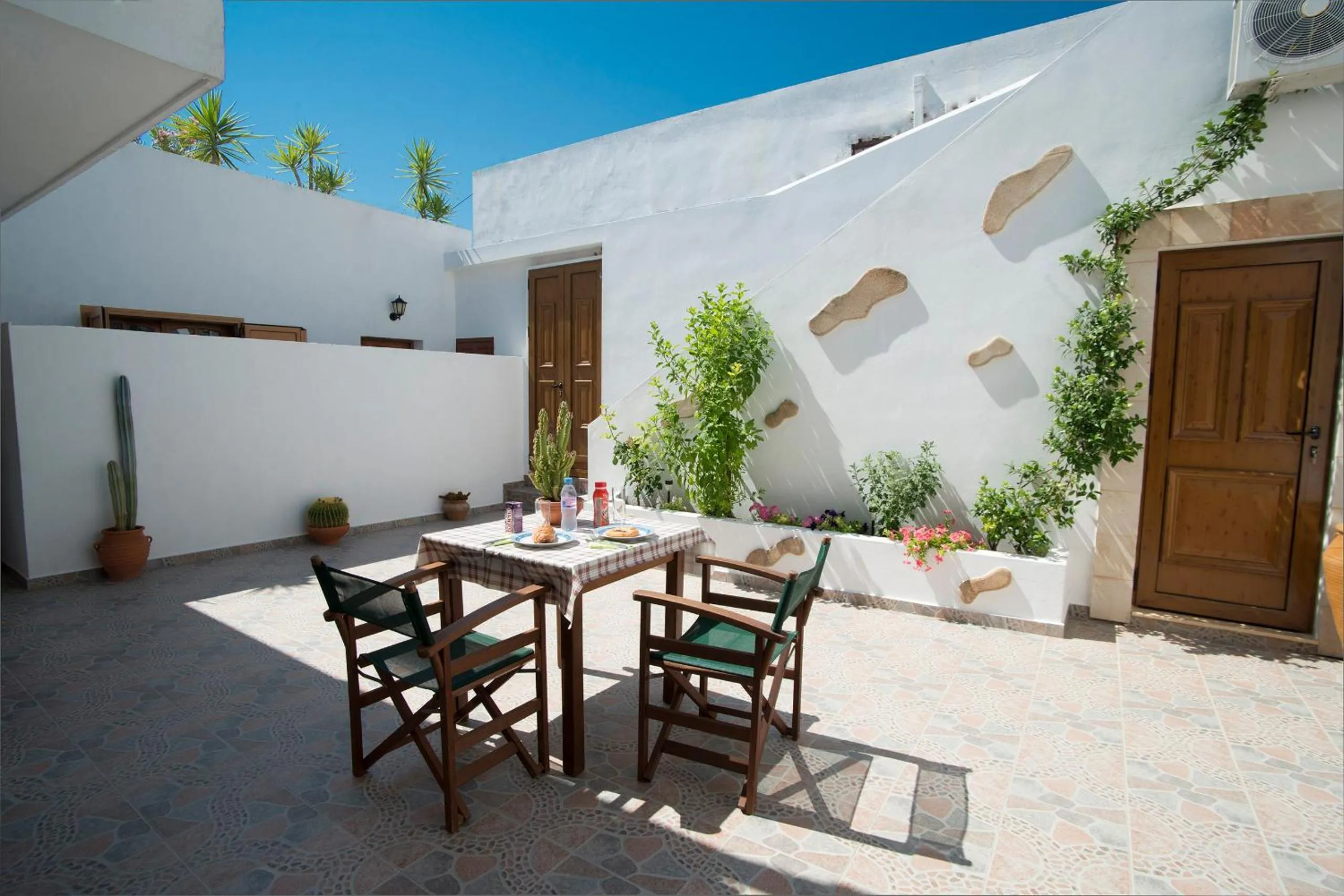 Facade/entrance in Lindos Center Studios