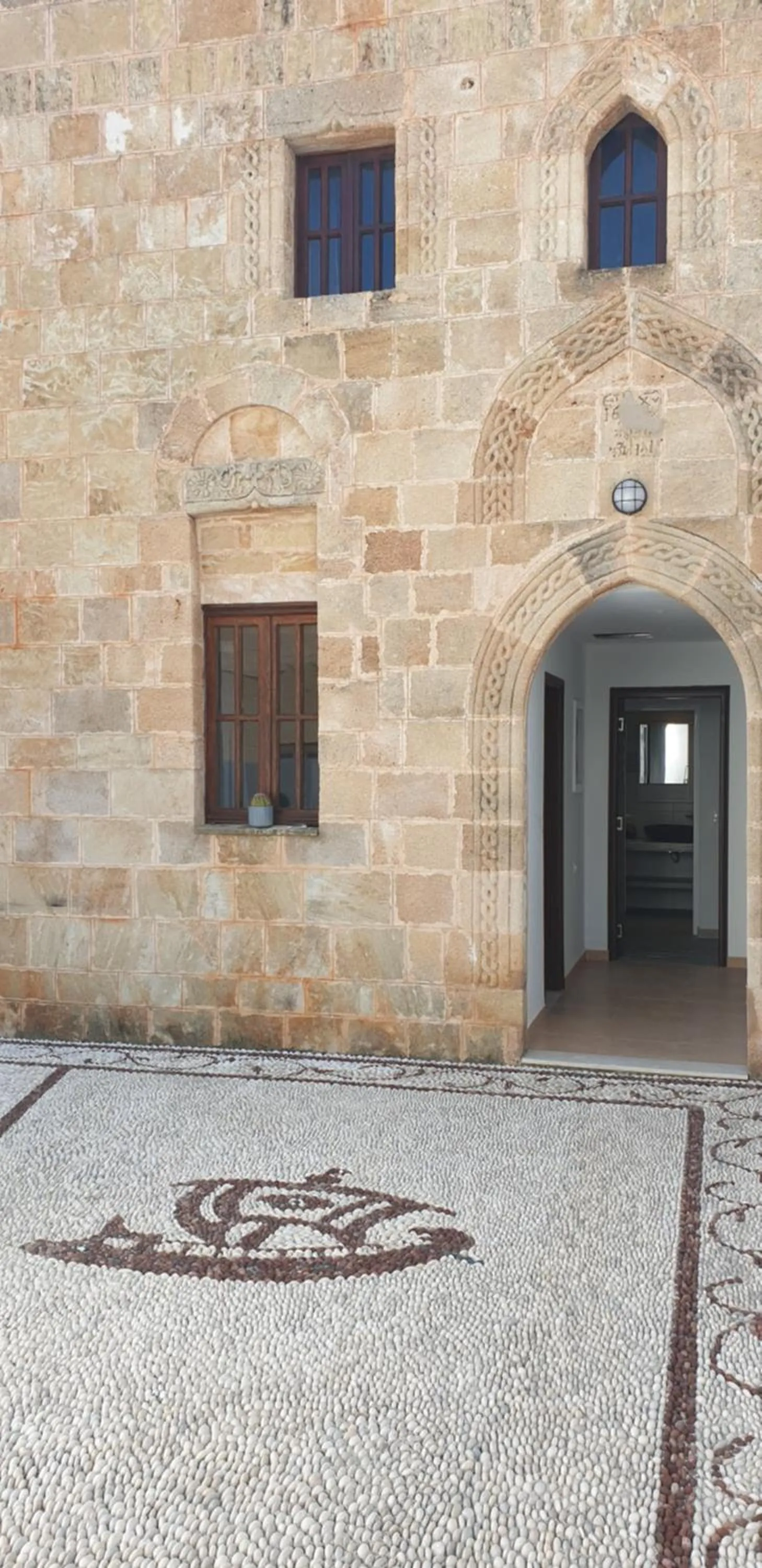 Facade/entrance in Lindos Center Studios