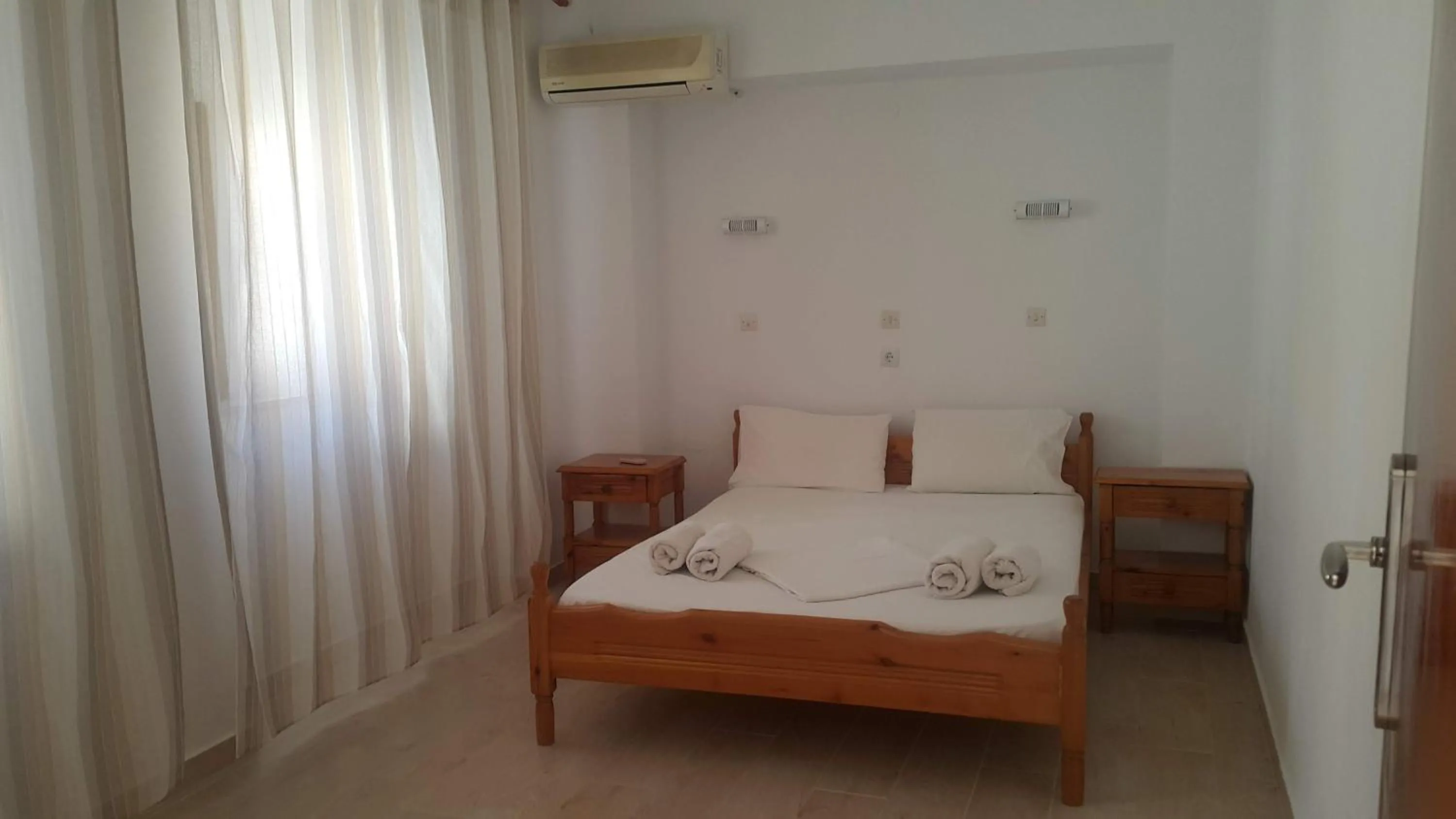 Photo of the whole room, Bed in Lindos Center Studios