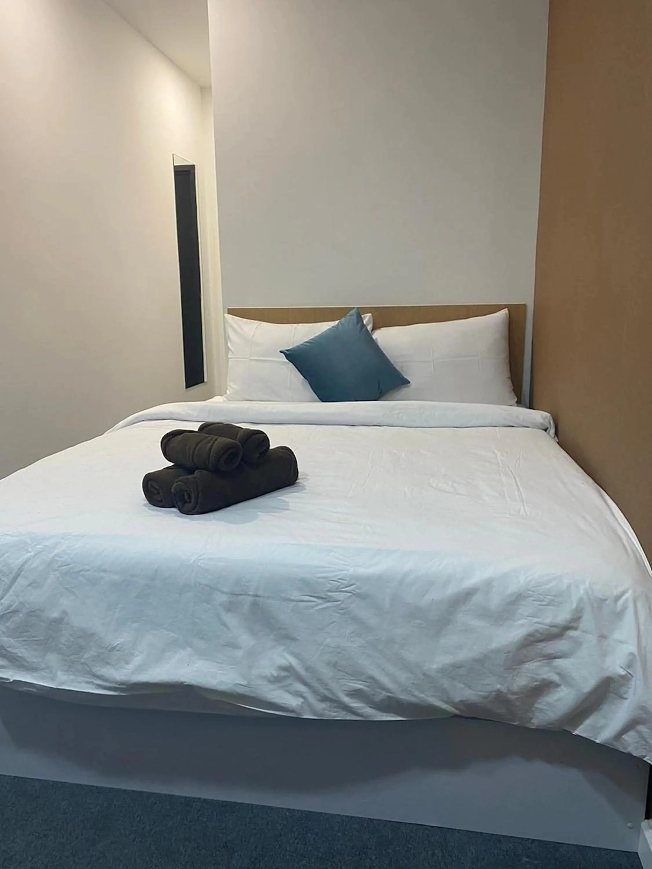 Bed in Nomads Homestay Sriracha