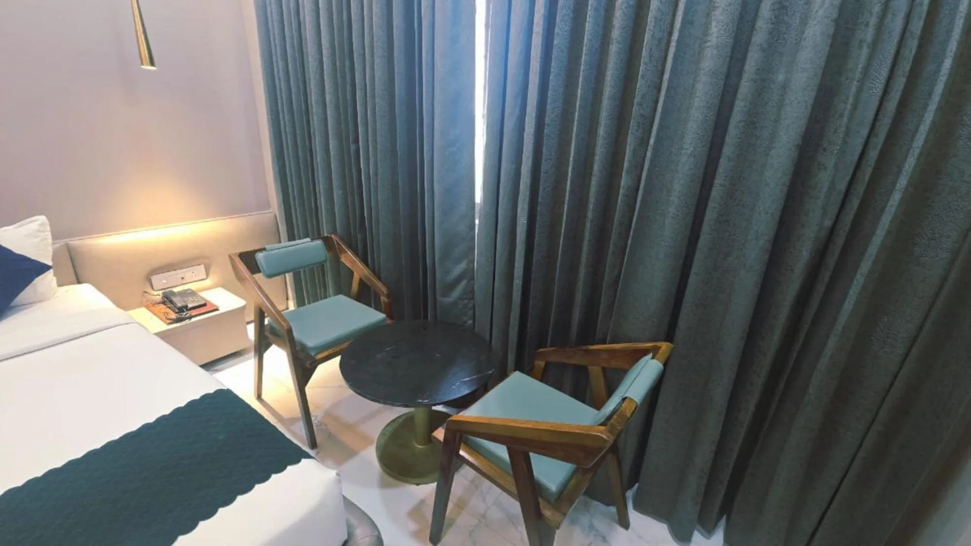 Living room, Bed in Hotel Laxmi Elite Karad