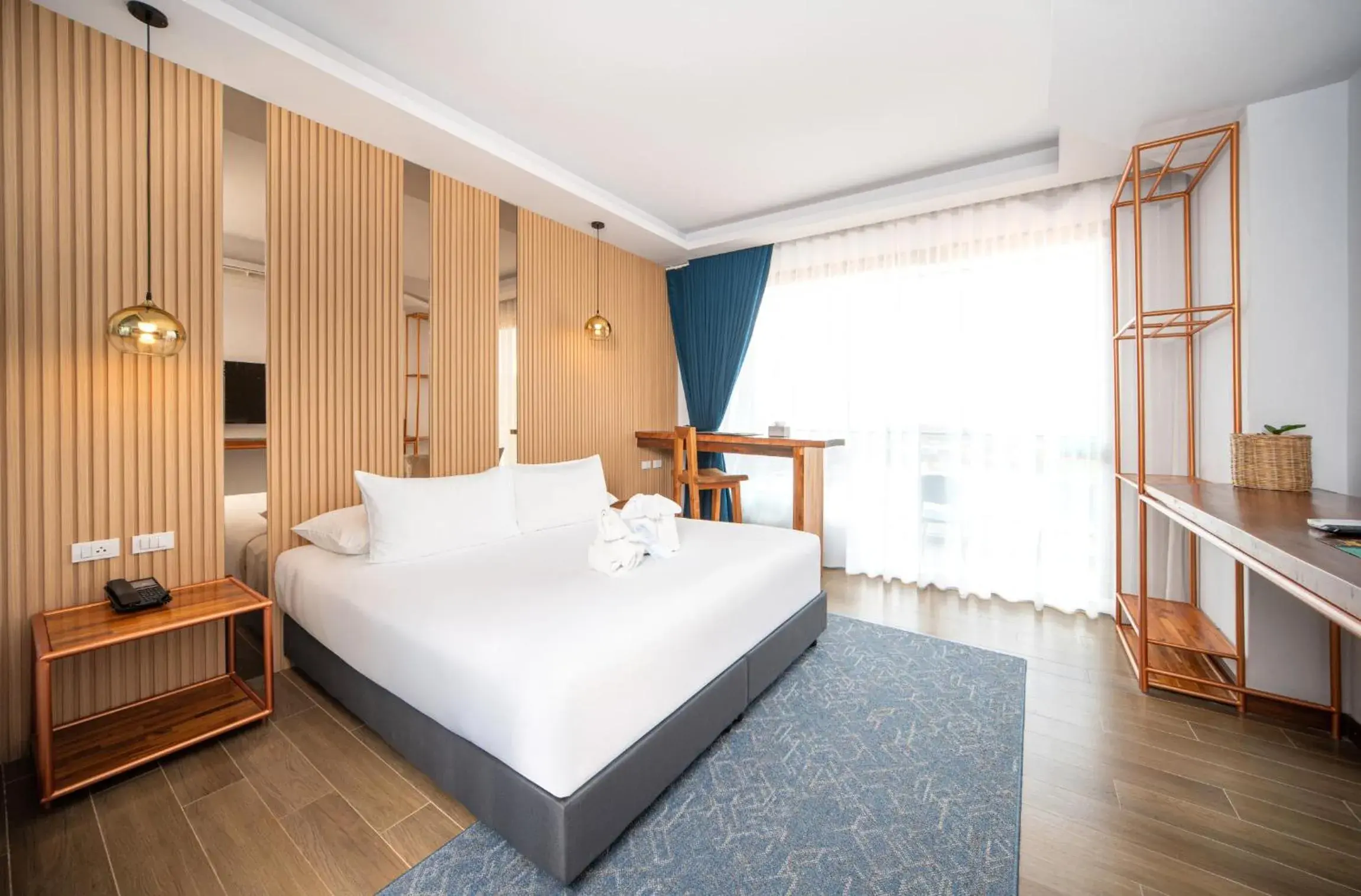 Bed in The Blue Hotel Bed in The Blue Hotel