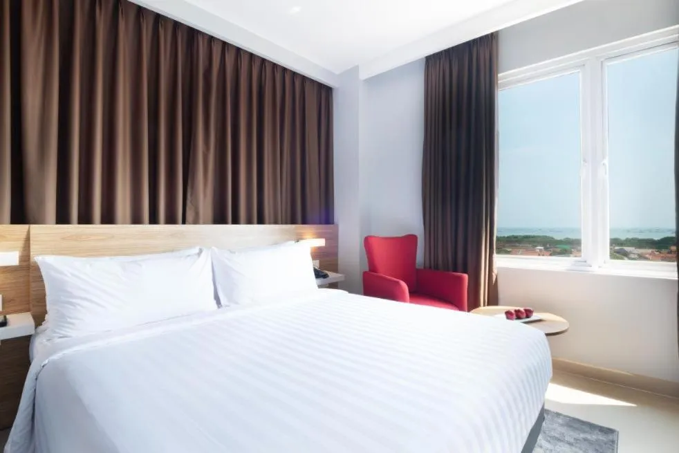 Bed in Hotel NEO Cirebon by ASTON