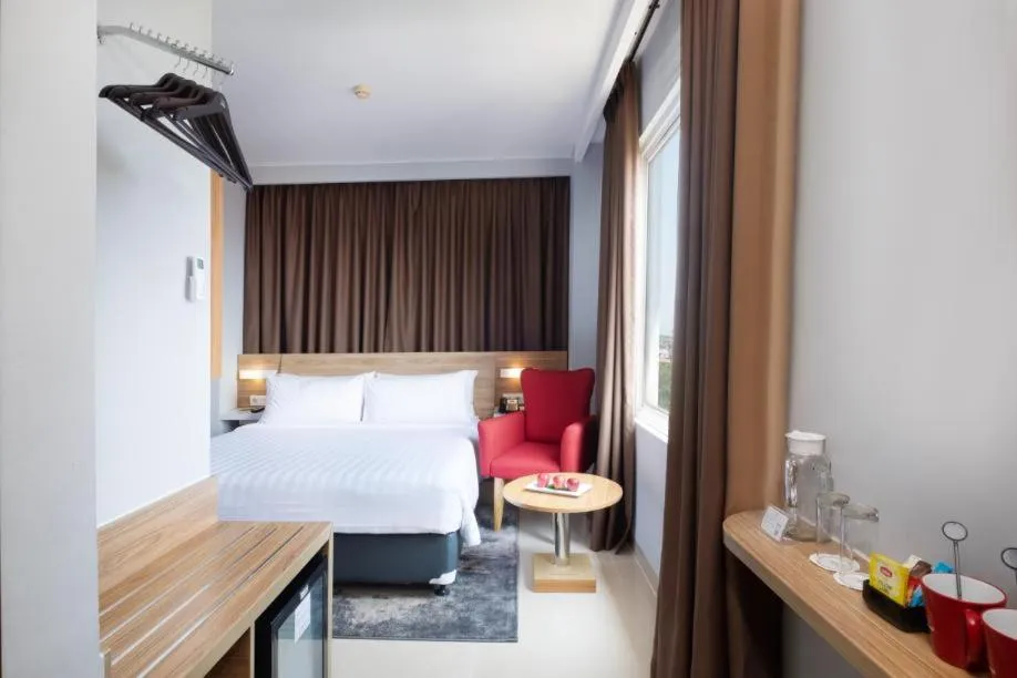 Bed in Hotel NEO Cirebon by ASTON