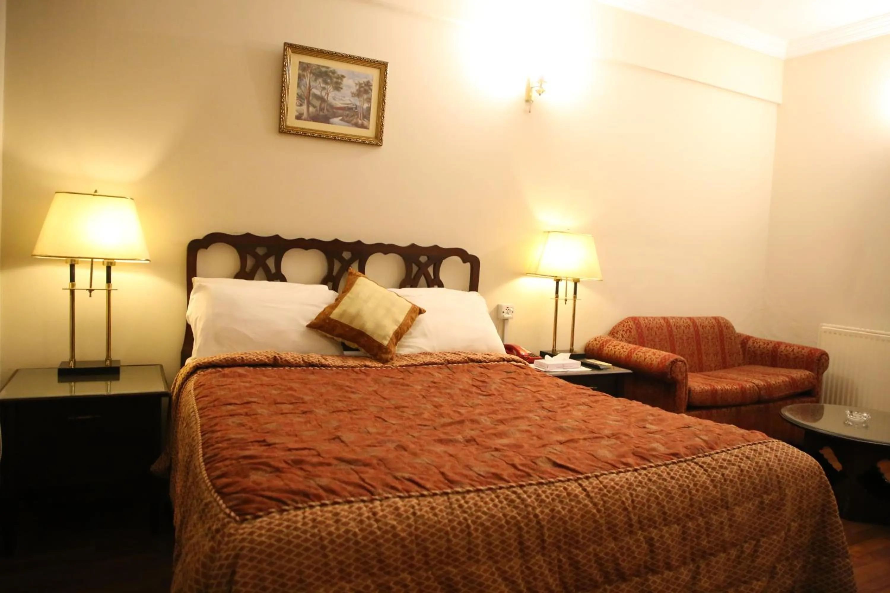 Bed in Carlton Tower Hotel Lahore