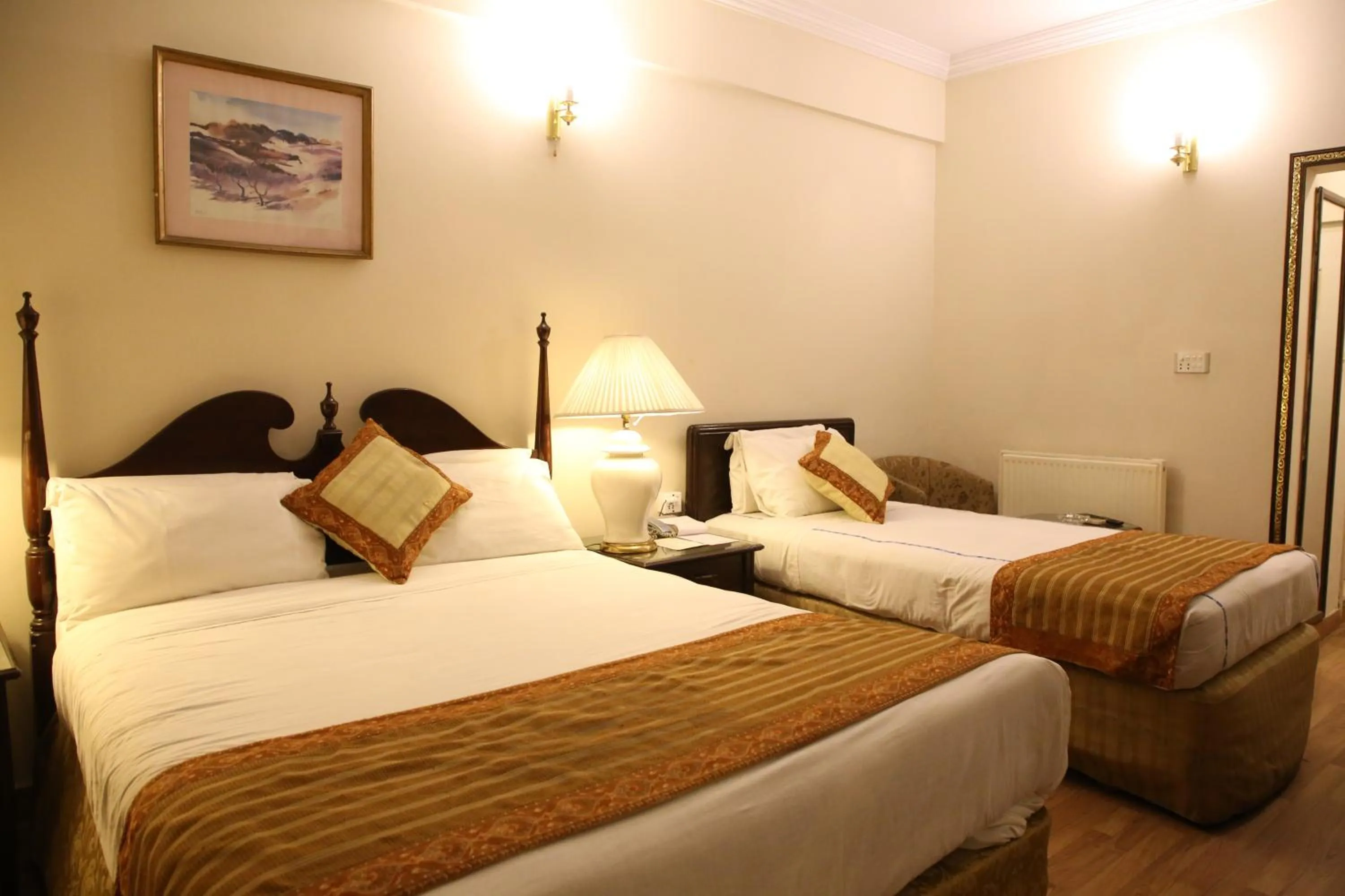 Bed in Carlton Tower Hotel Lahore