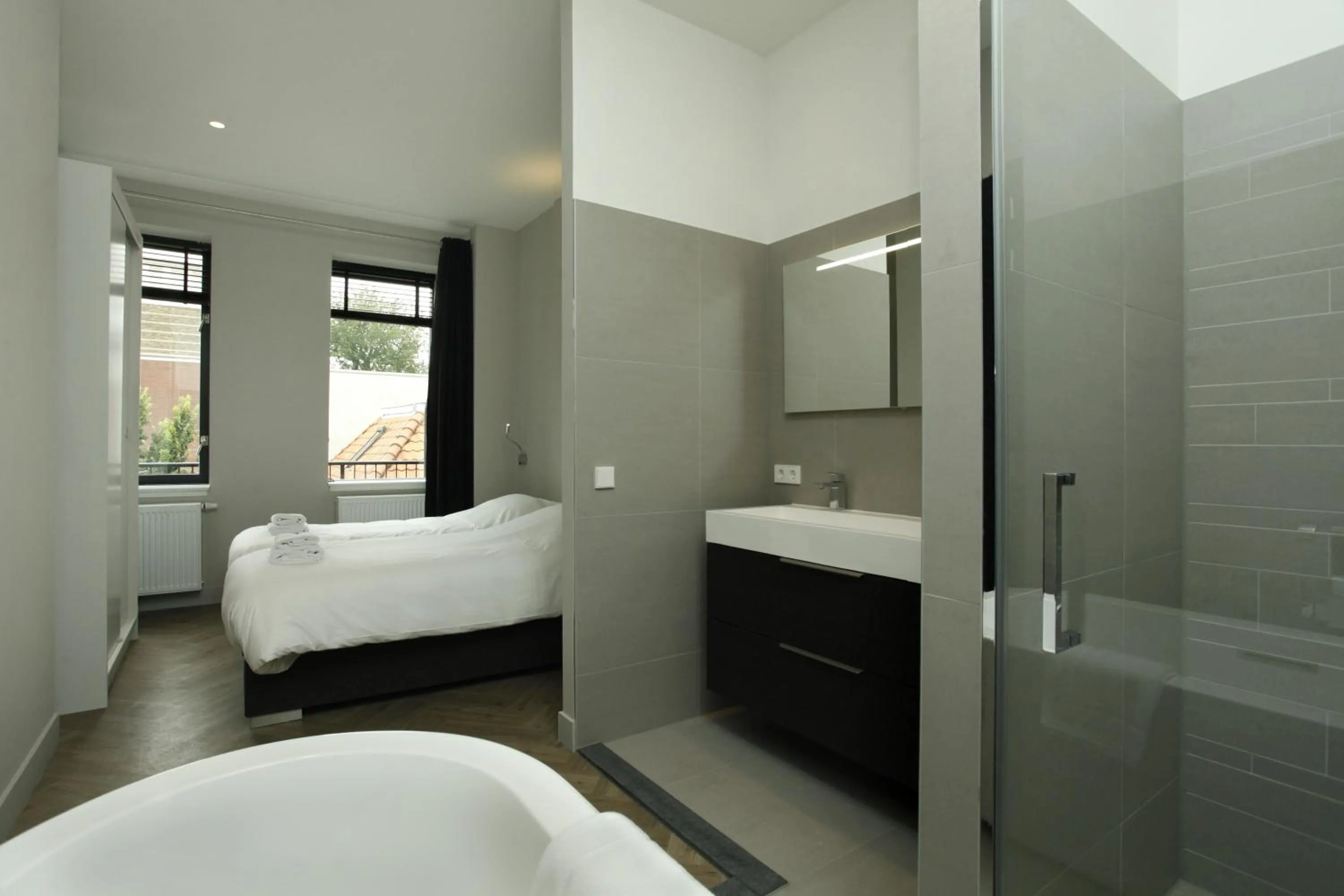 Shower, Bed in Stayci Serviced Apartments Westeinde