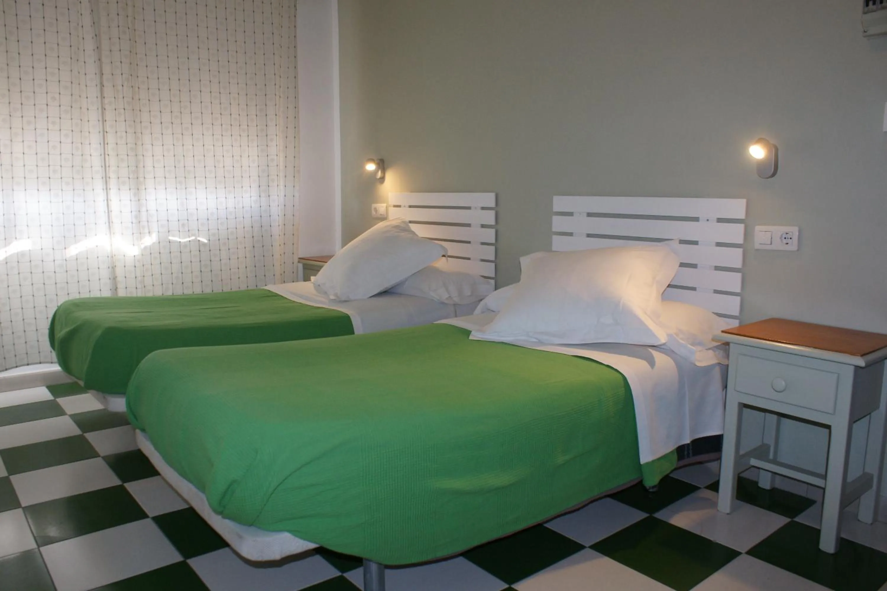 Bed in Hostal Puerto Beach