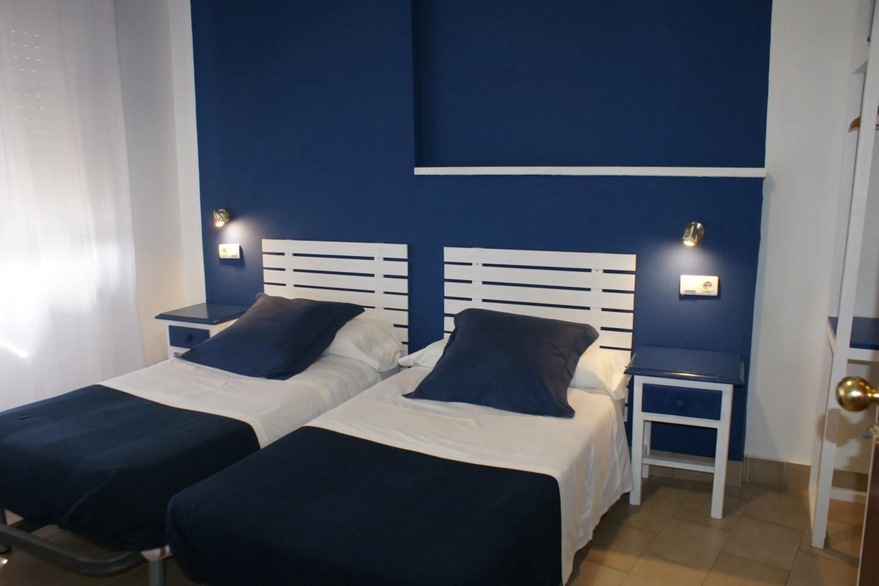 Bed in Hostal Puerto Beach