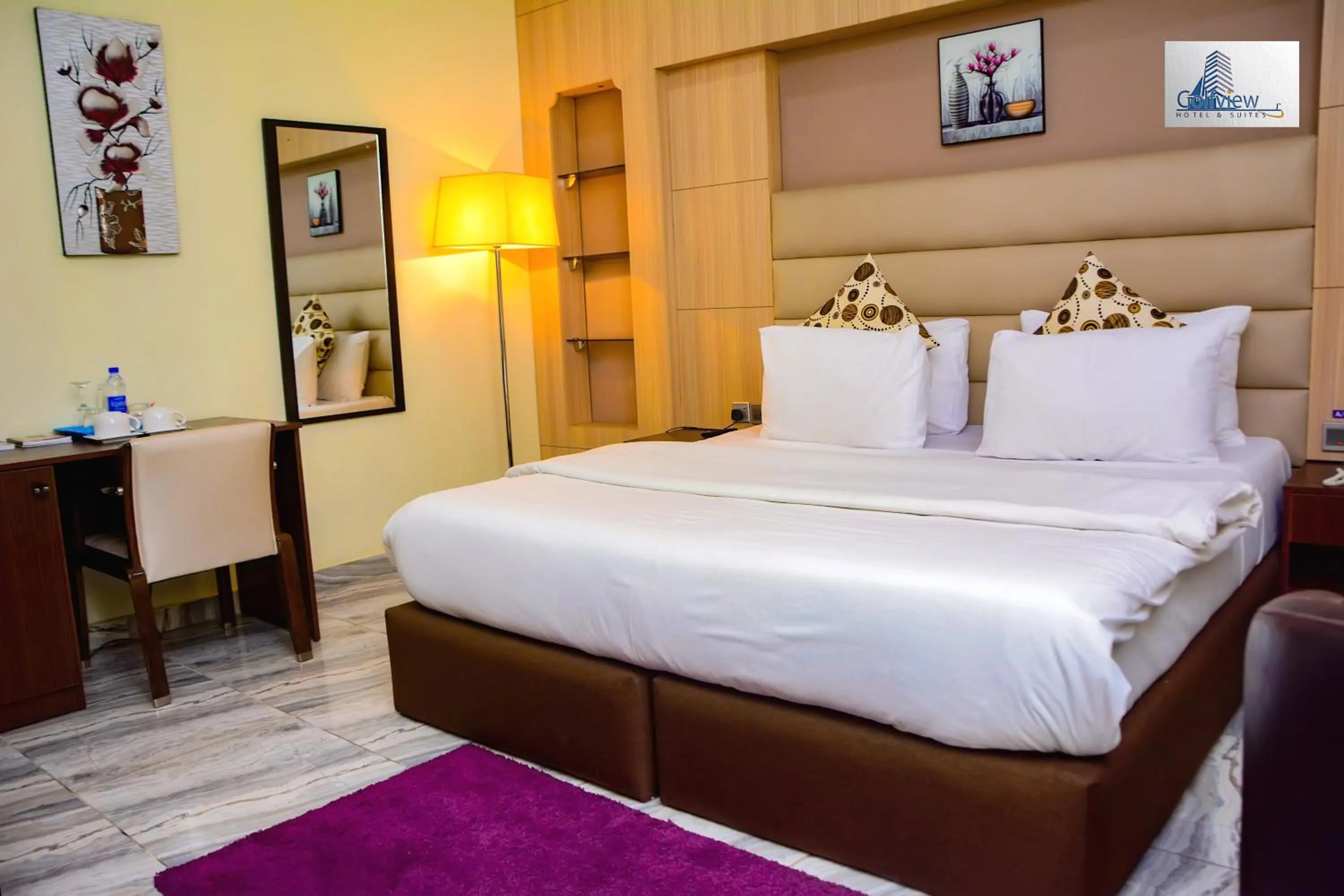 Bed in GolfView Suites & Conference Center