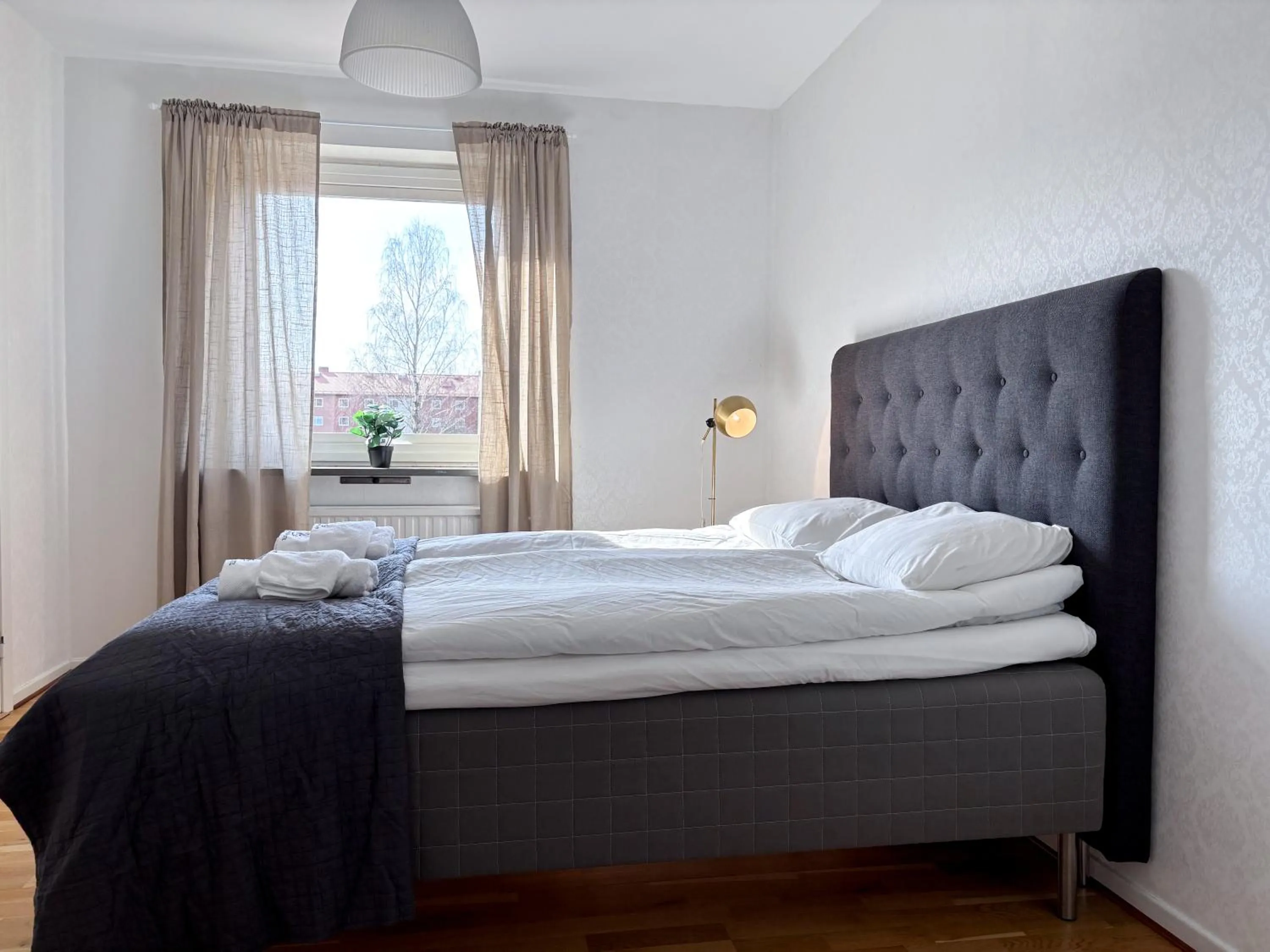 Bed in Säffle Suites by Svaneholm Hotel