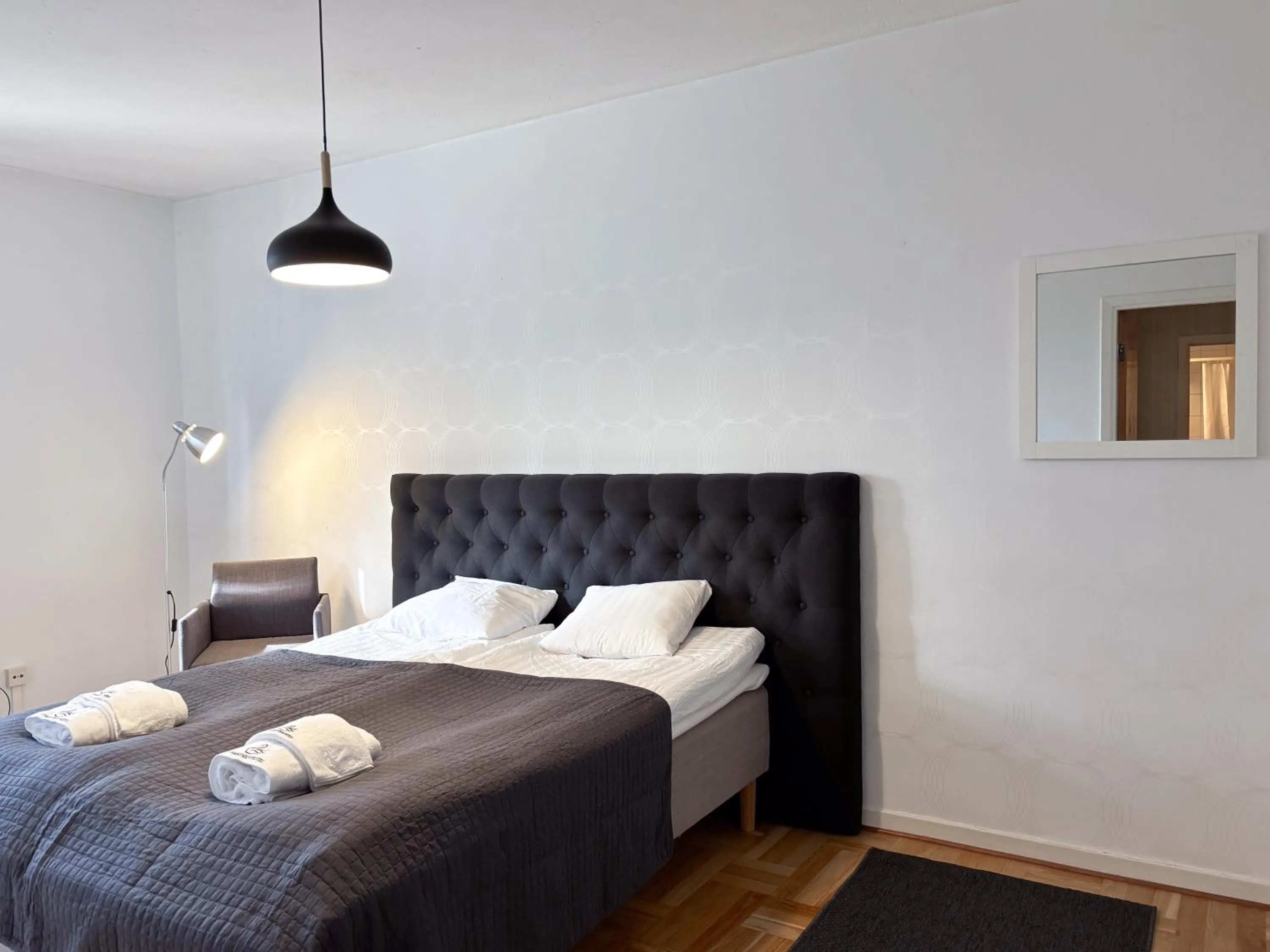 Bed in Säffle Suites by Svaneholm Hotel