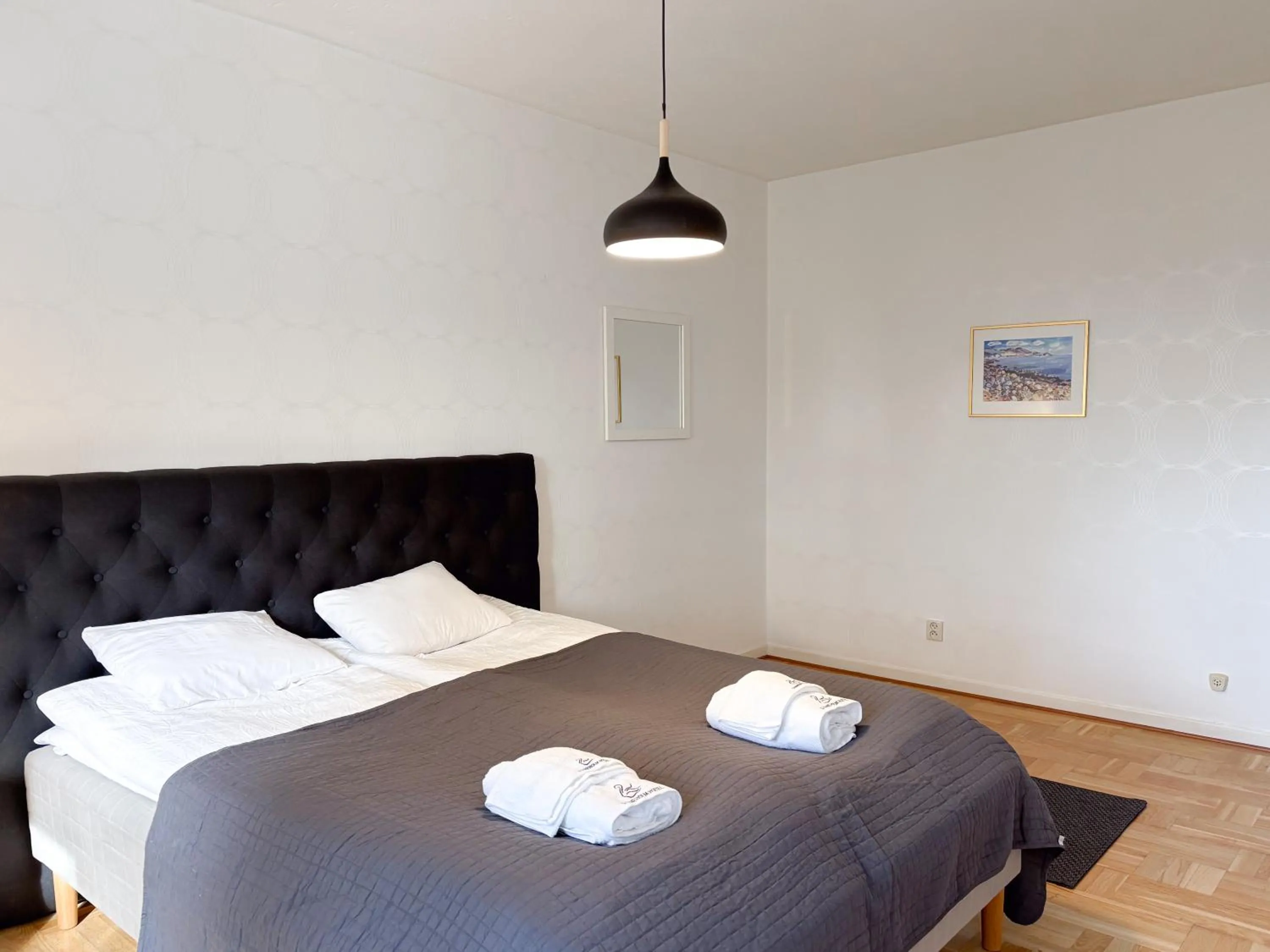 Bed in Säffle Suites by Svaneholm Hotel