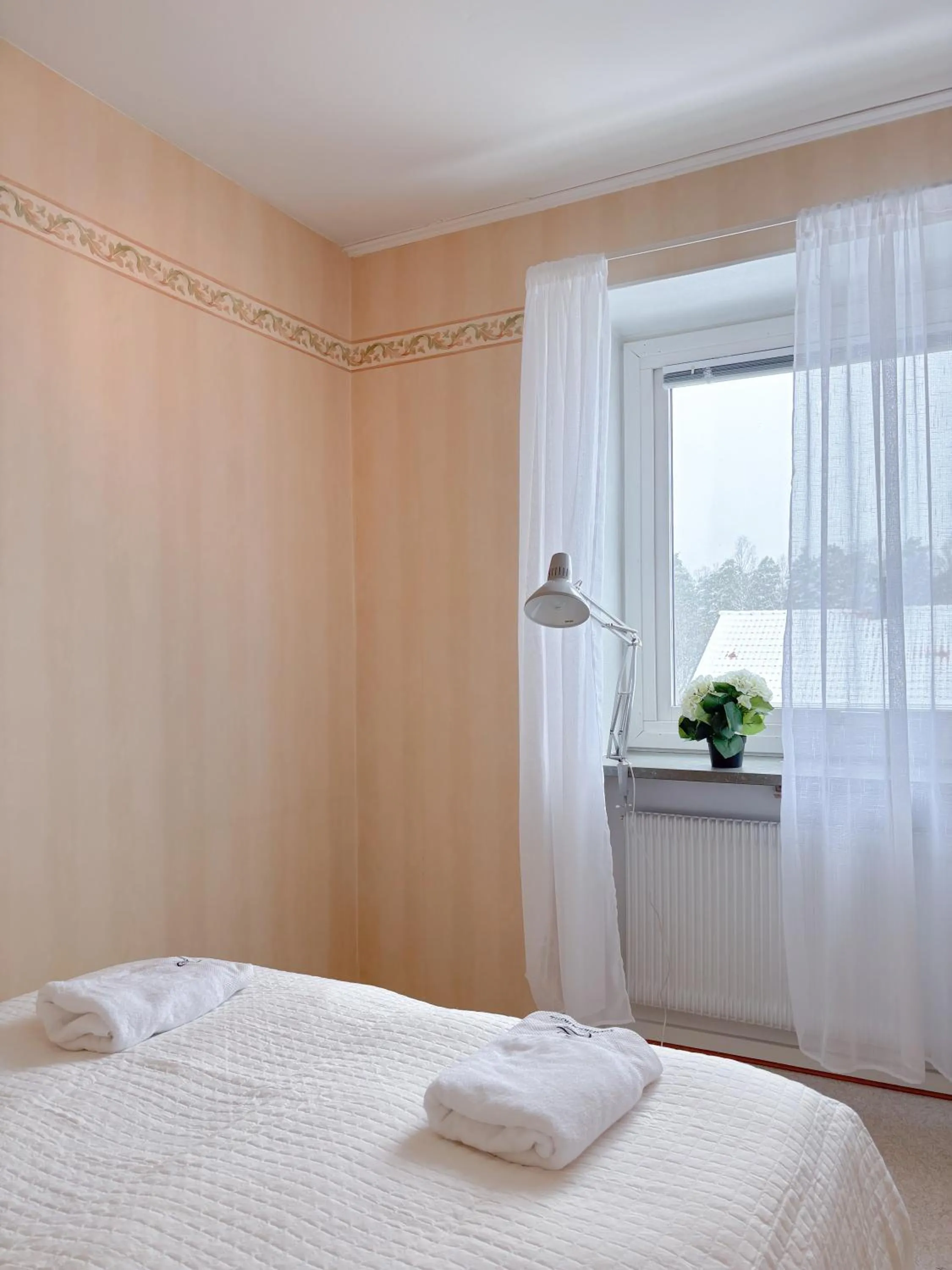 Bed in Säffle Suites by Svaneholm Hotel