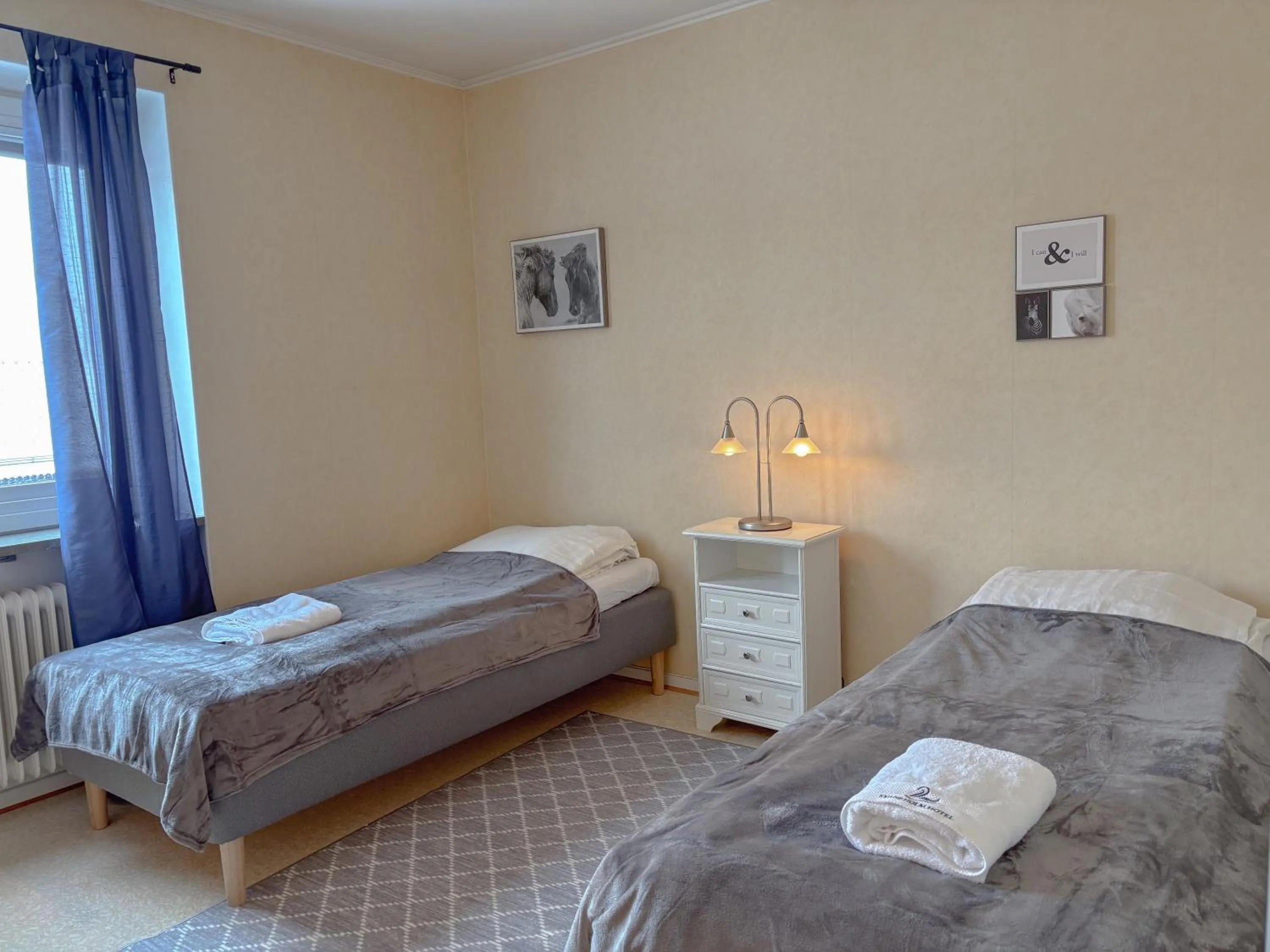 Bed in Säffle Suites by Svaneholm Hotel