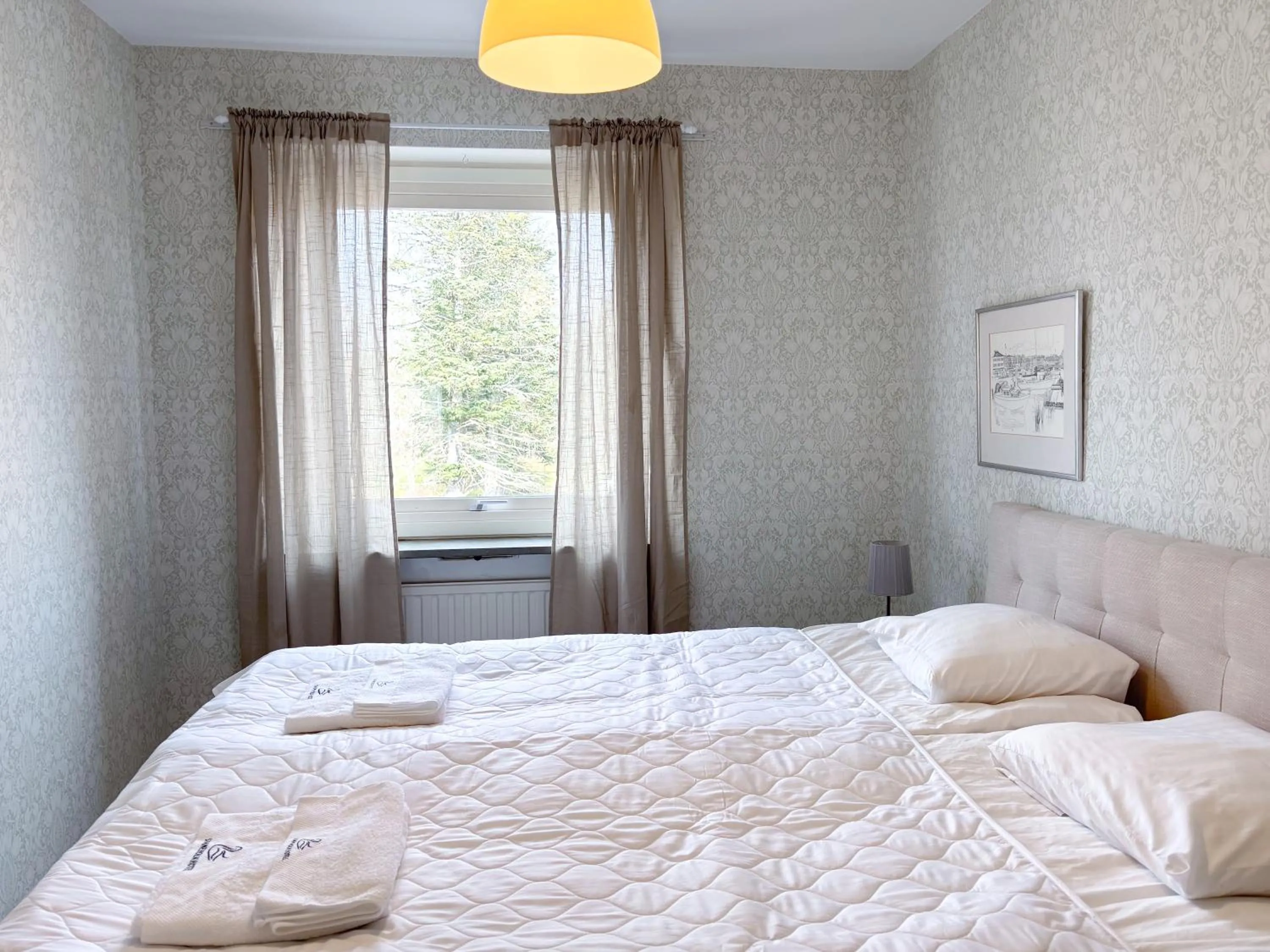 Bed in Säffle Suites by Svaneholm Hotel