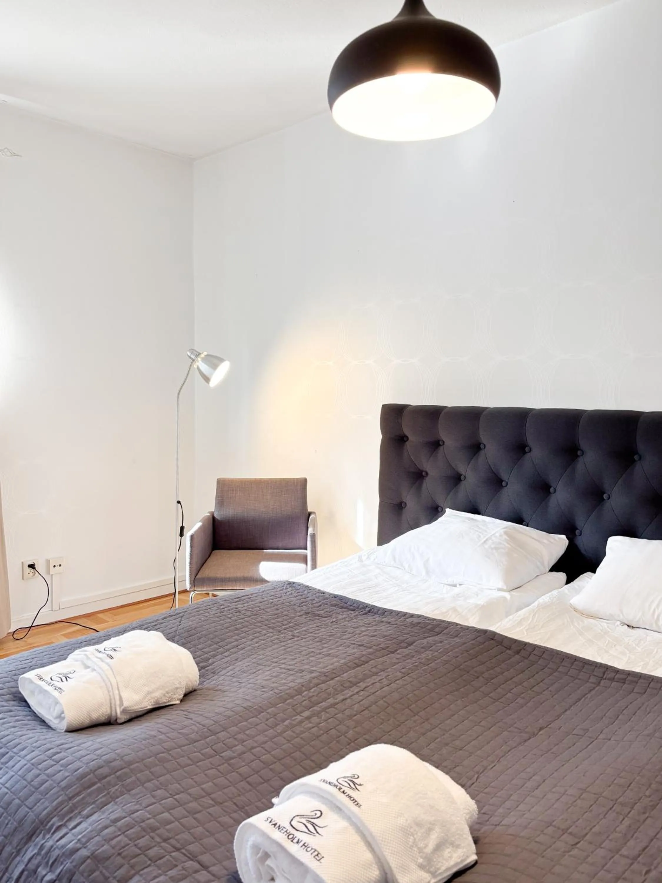 Bed in Säffle Suites by Svaneholm Hotel