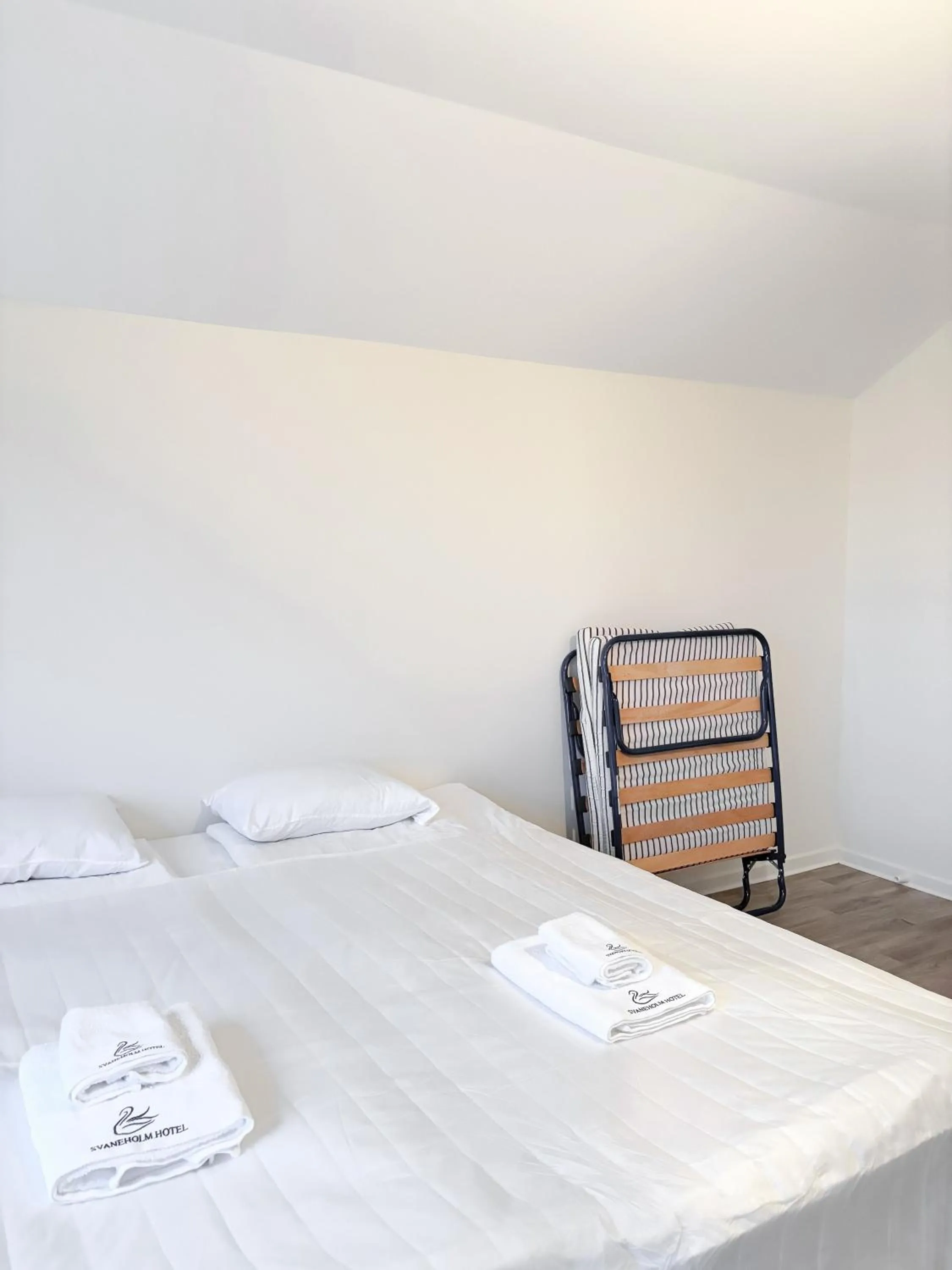 Bed in Säffle Suites by Svaneholm Hotel