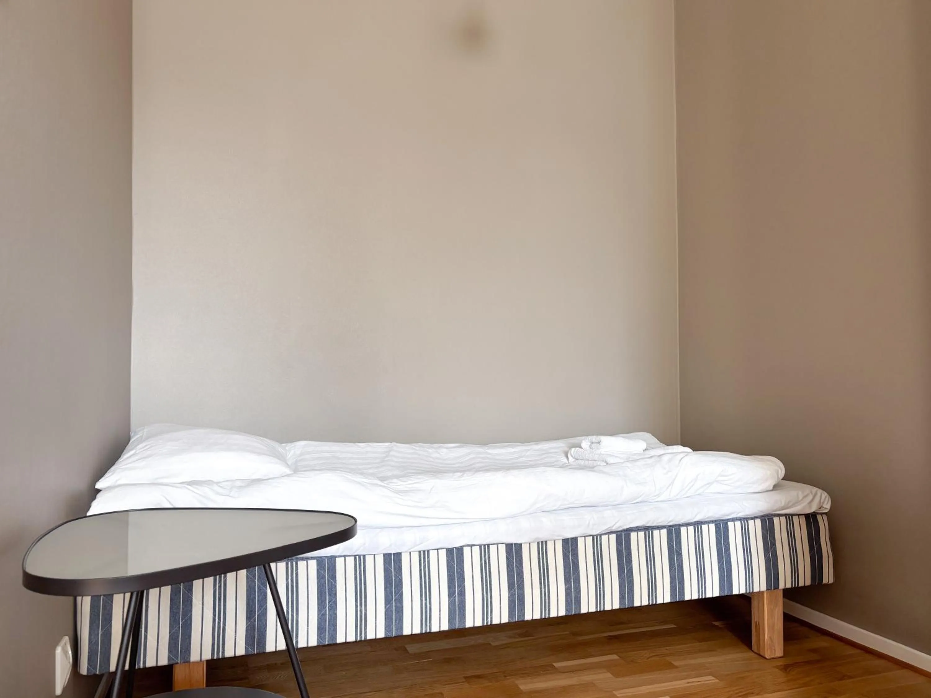 Bed in Säffle Suites by Svaneholm Hotel