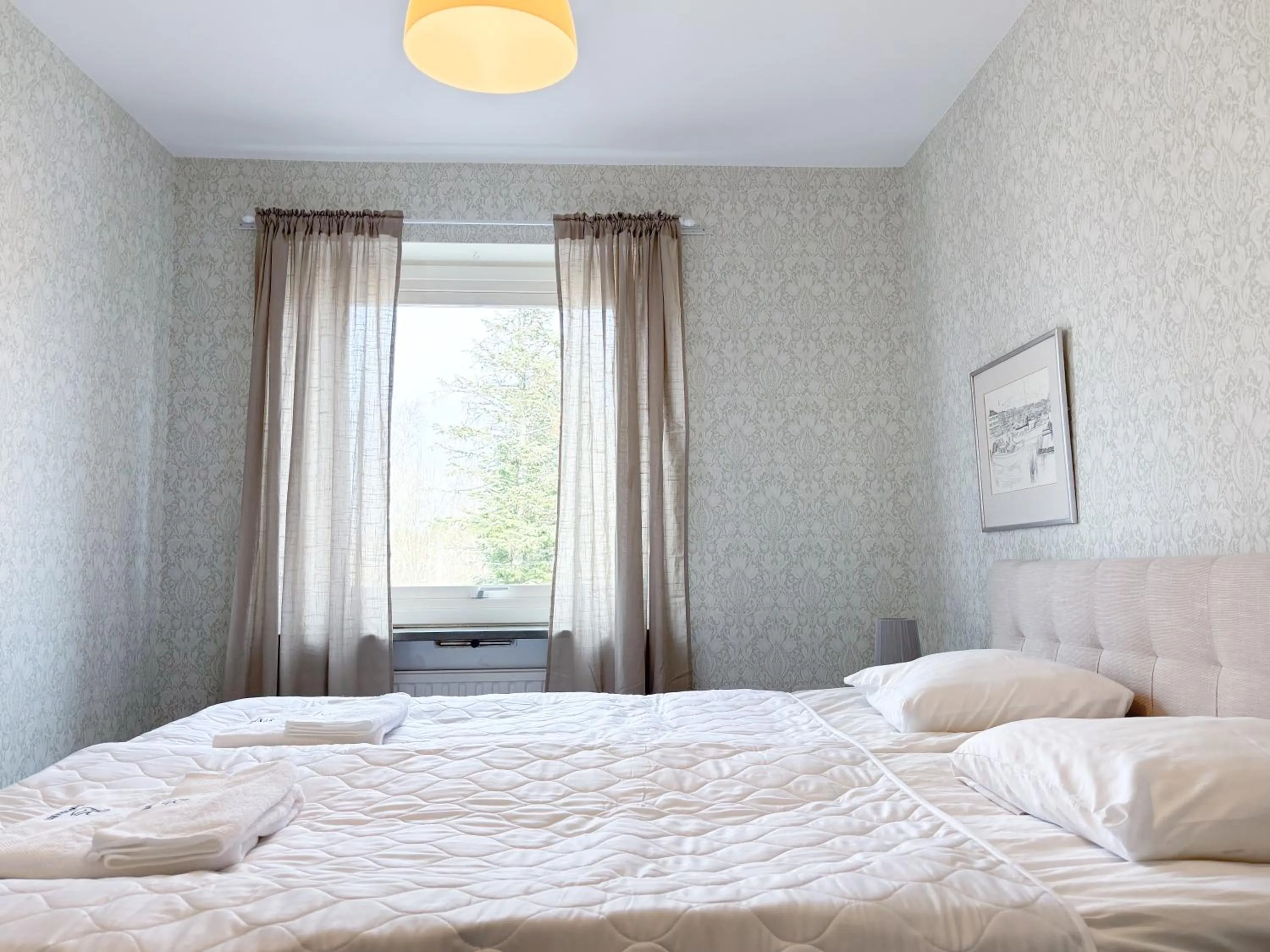 Bed in Säffle Suites by Svaneholm Hotel