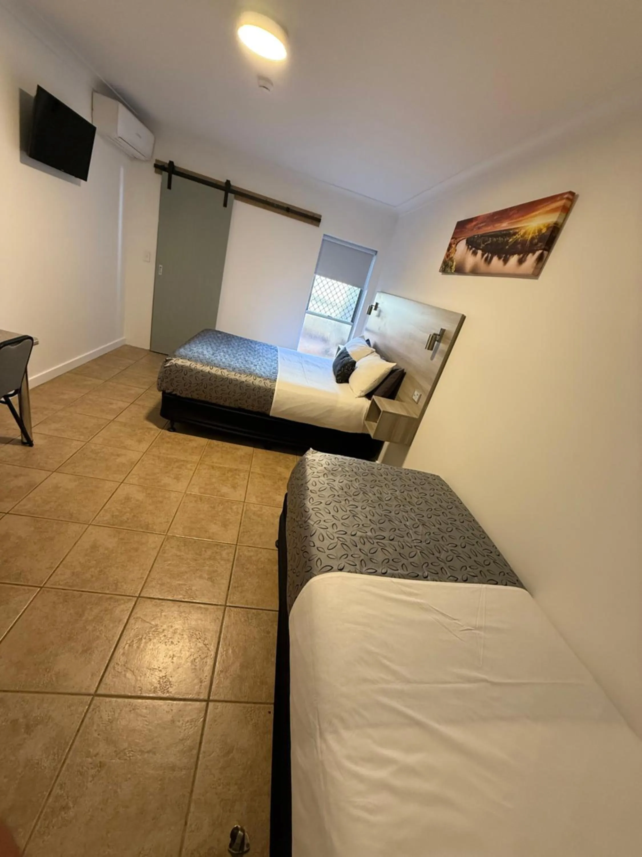 Bed in Childers Oasis Motel