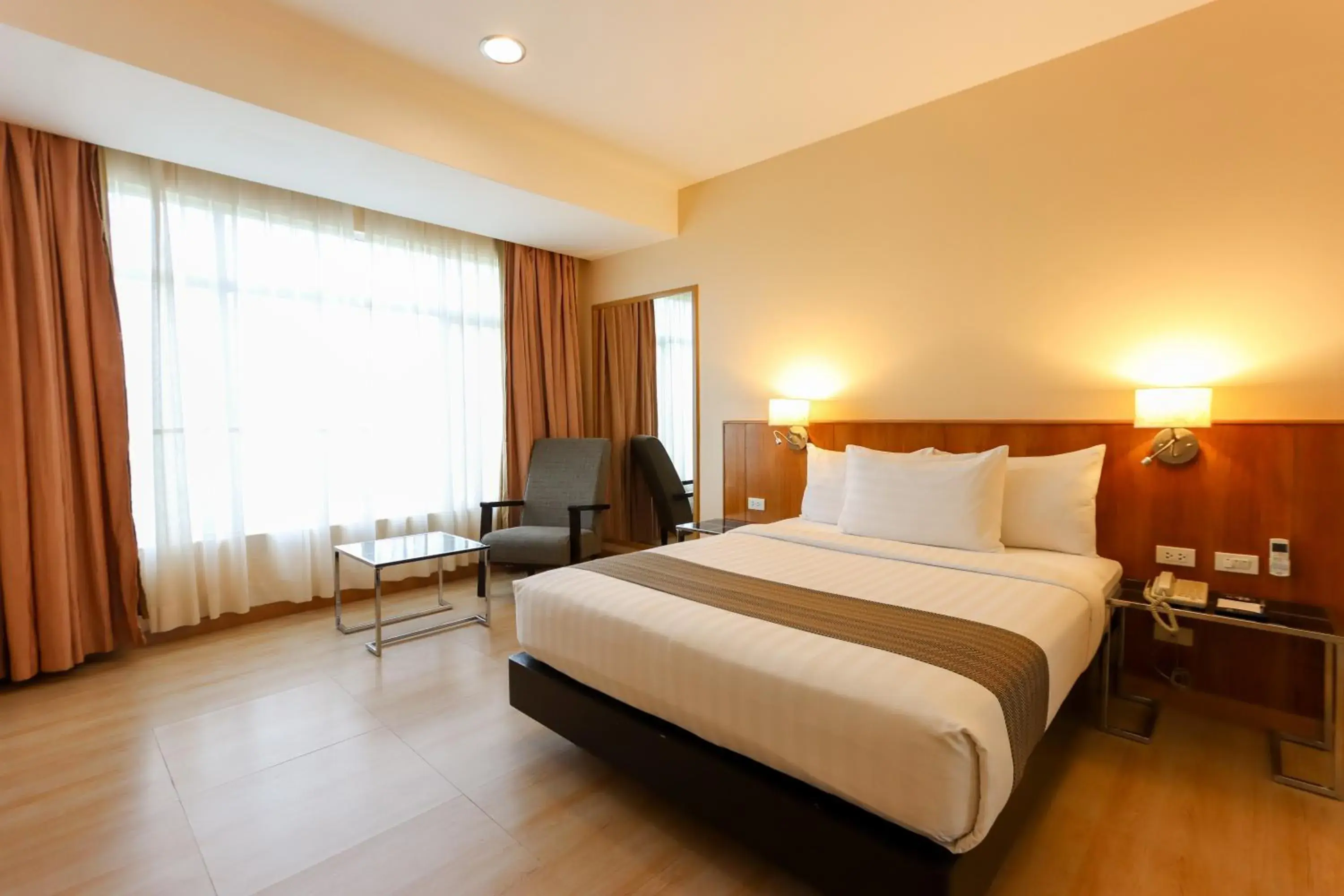 Bedroom in Paseo Premiere Hotel Bedroom in Paseo Premiere Hotel