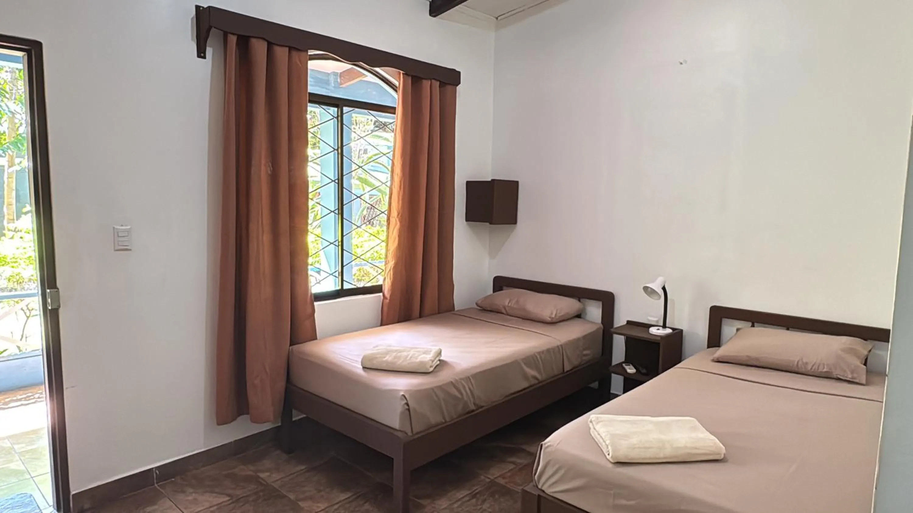 Bed in Hotel Marielos Tamarindo