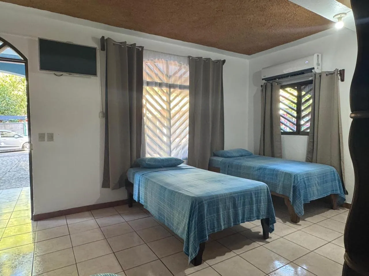 Bed in Hotel Marielos Tamarindo