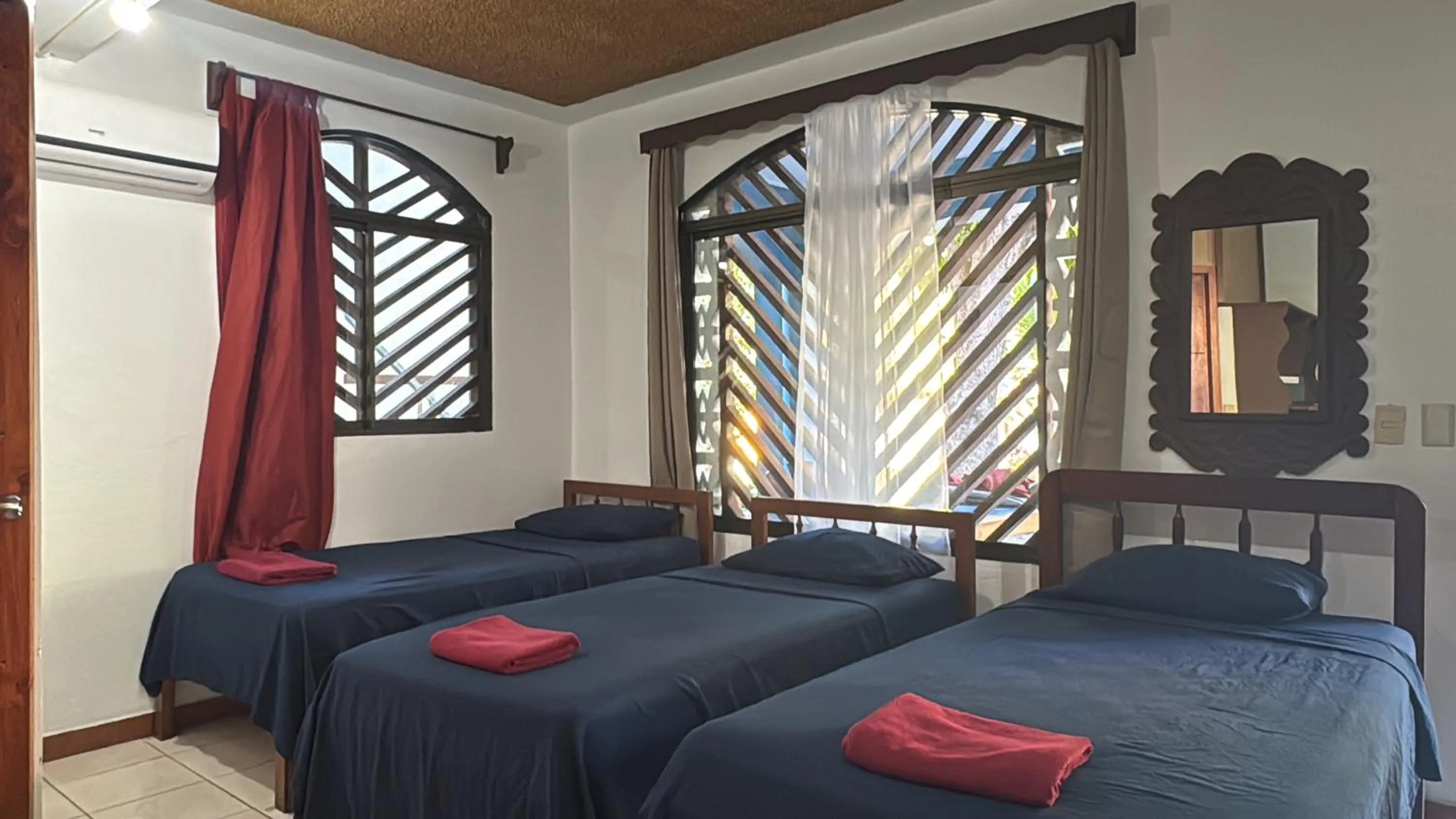 Bed in Hotel Marielos Tamarindo