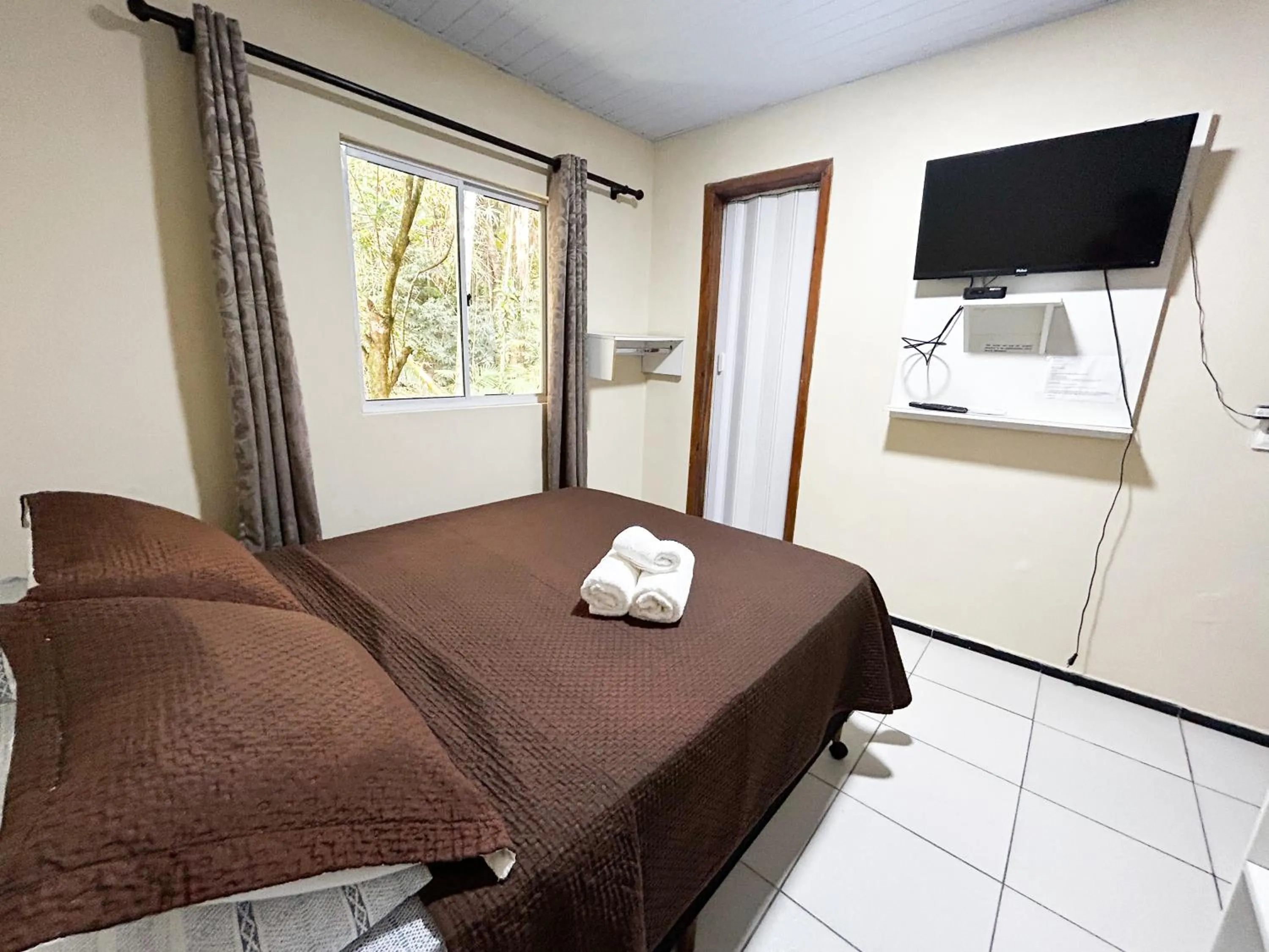 Bed in Pousada Toca da Ilha