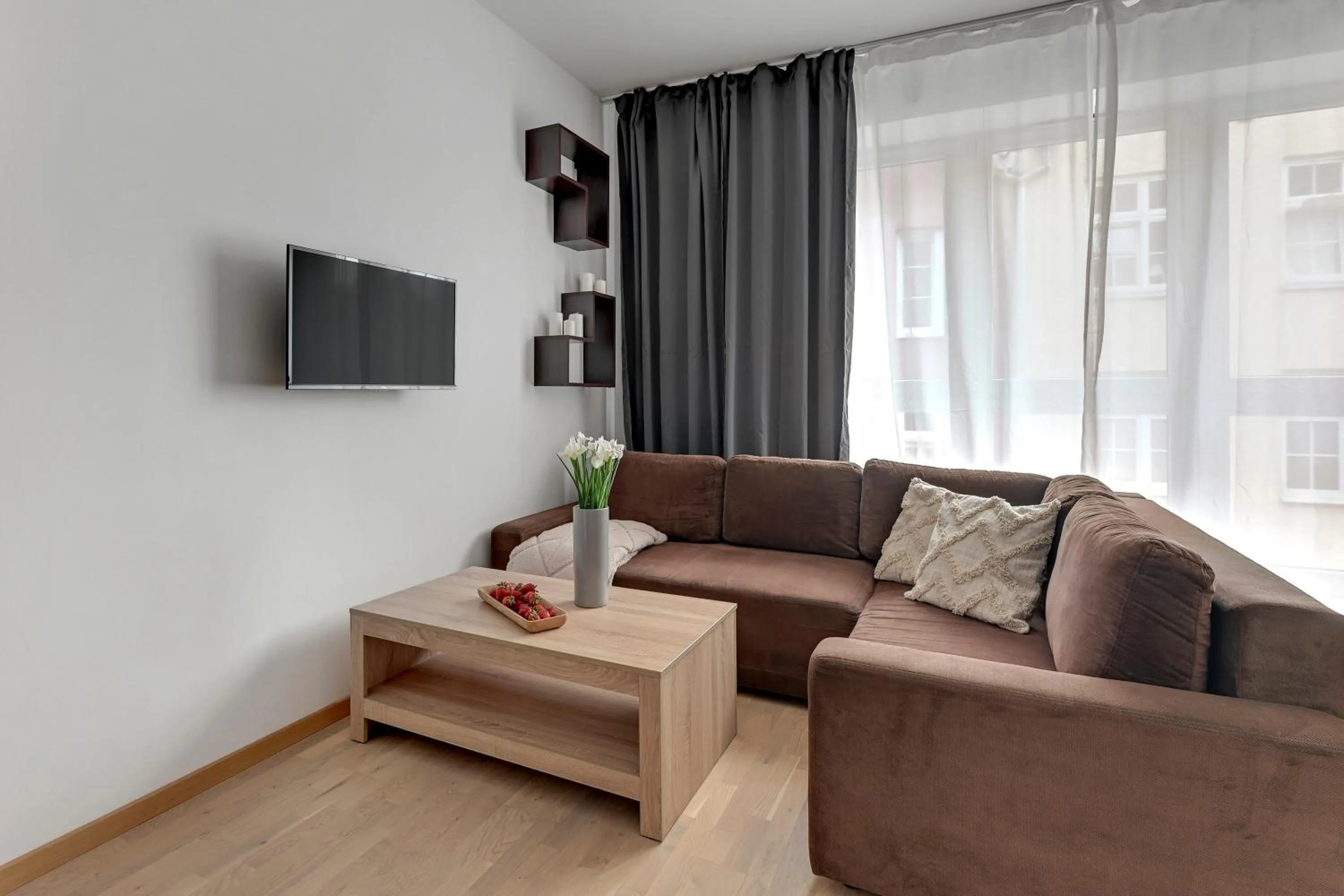 Living room in Old Town by Welcome Apartment