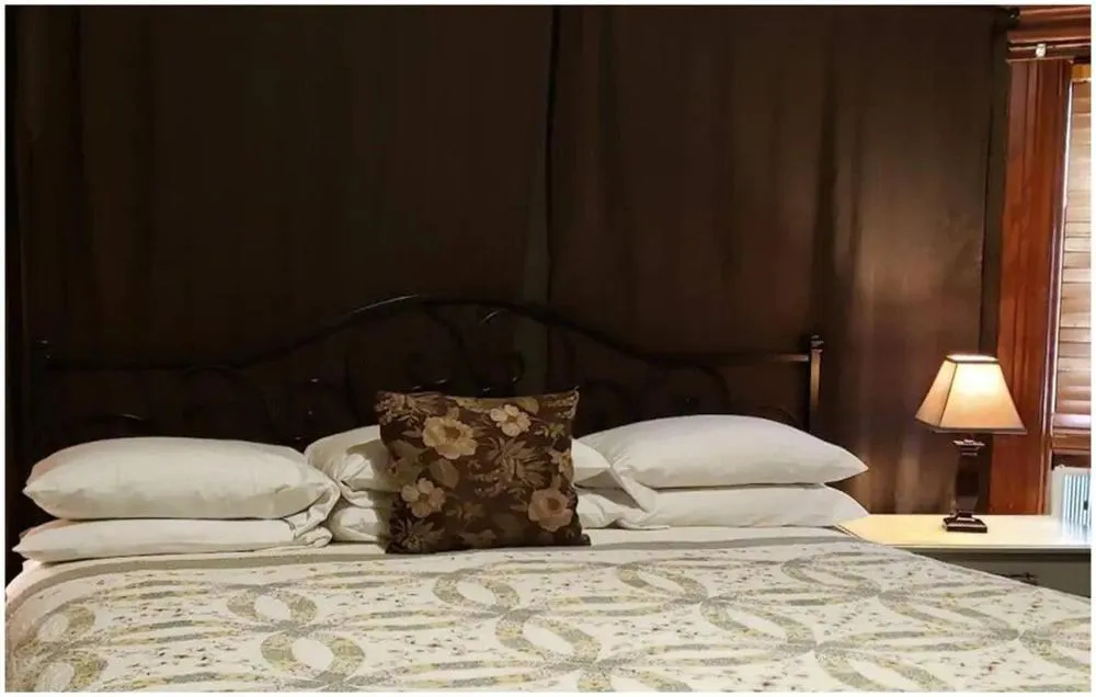 Bed in Cabernet House, an Old World Inn