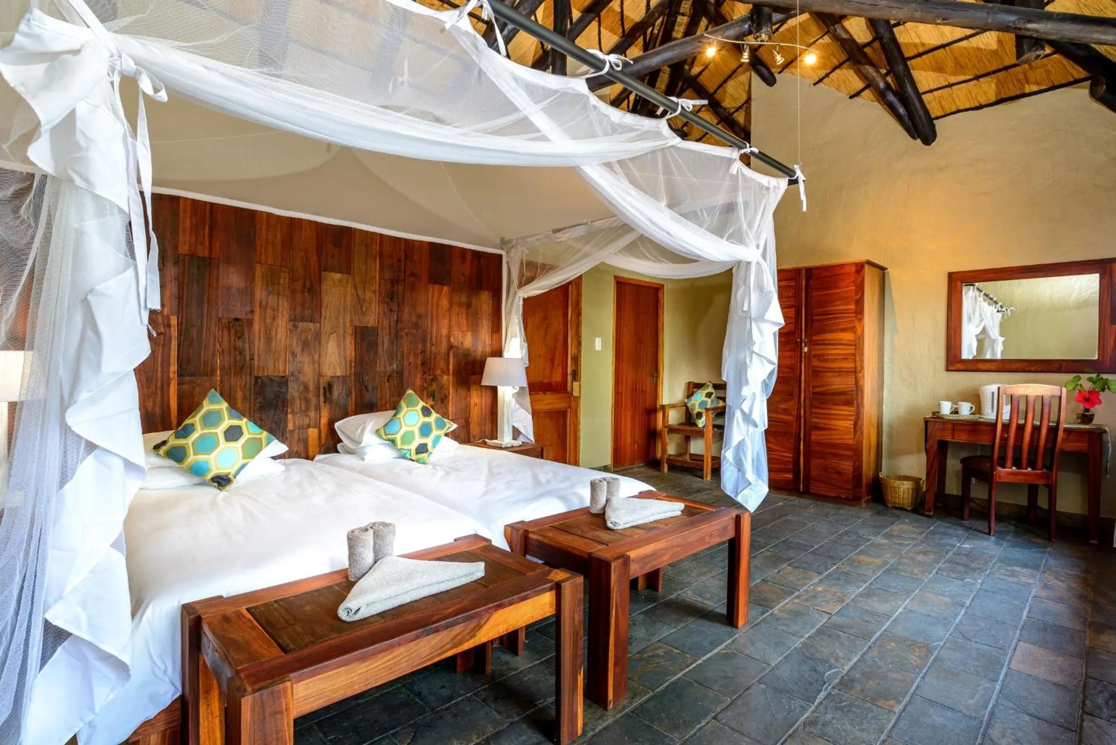 Bed in Gondwana Namushasha River Lodge