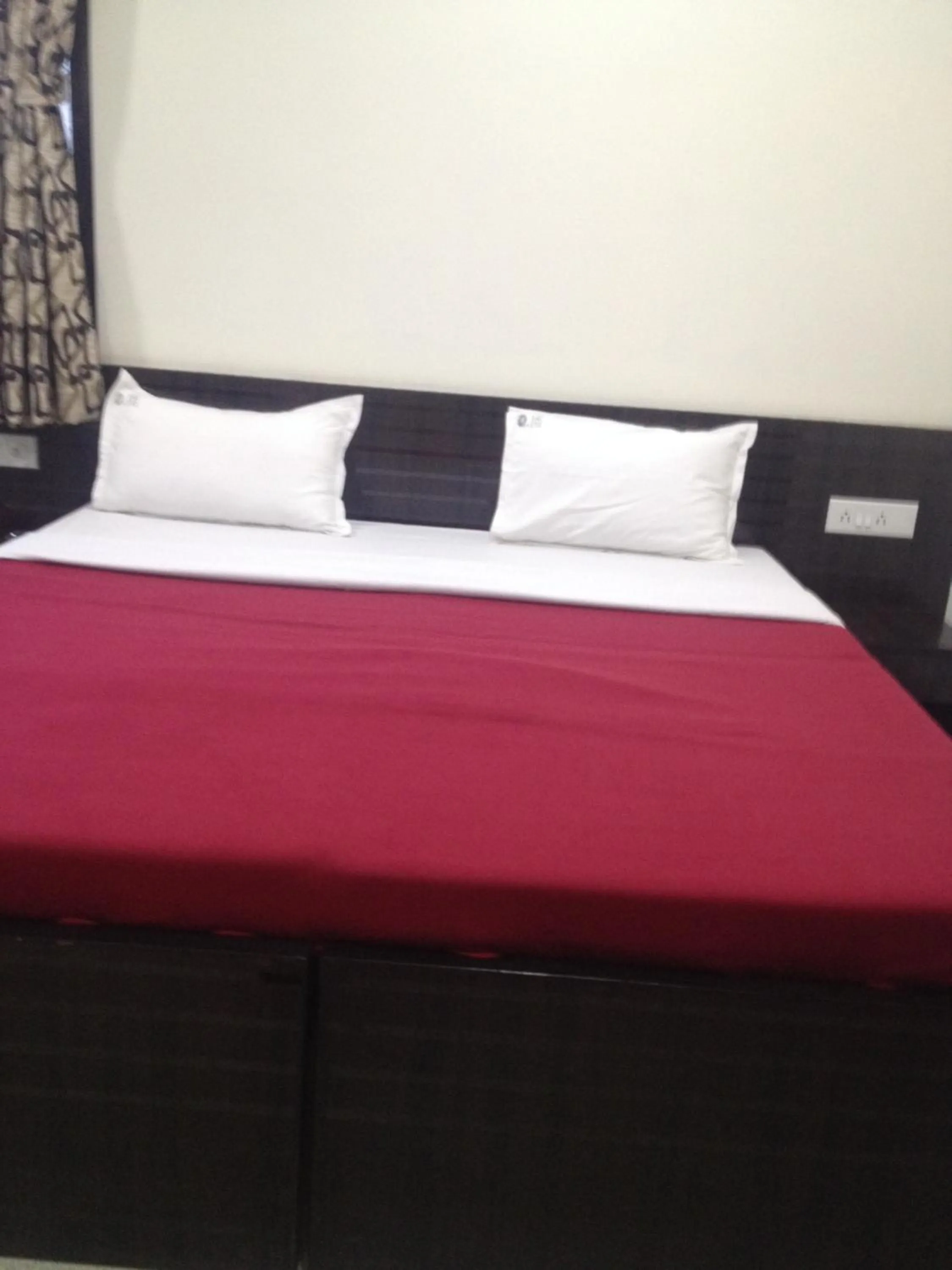 Bed in Hotel Nest International